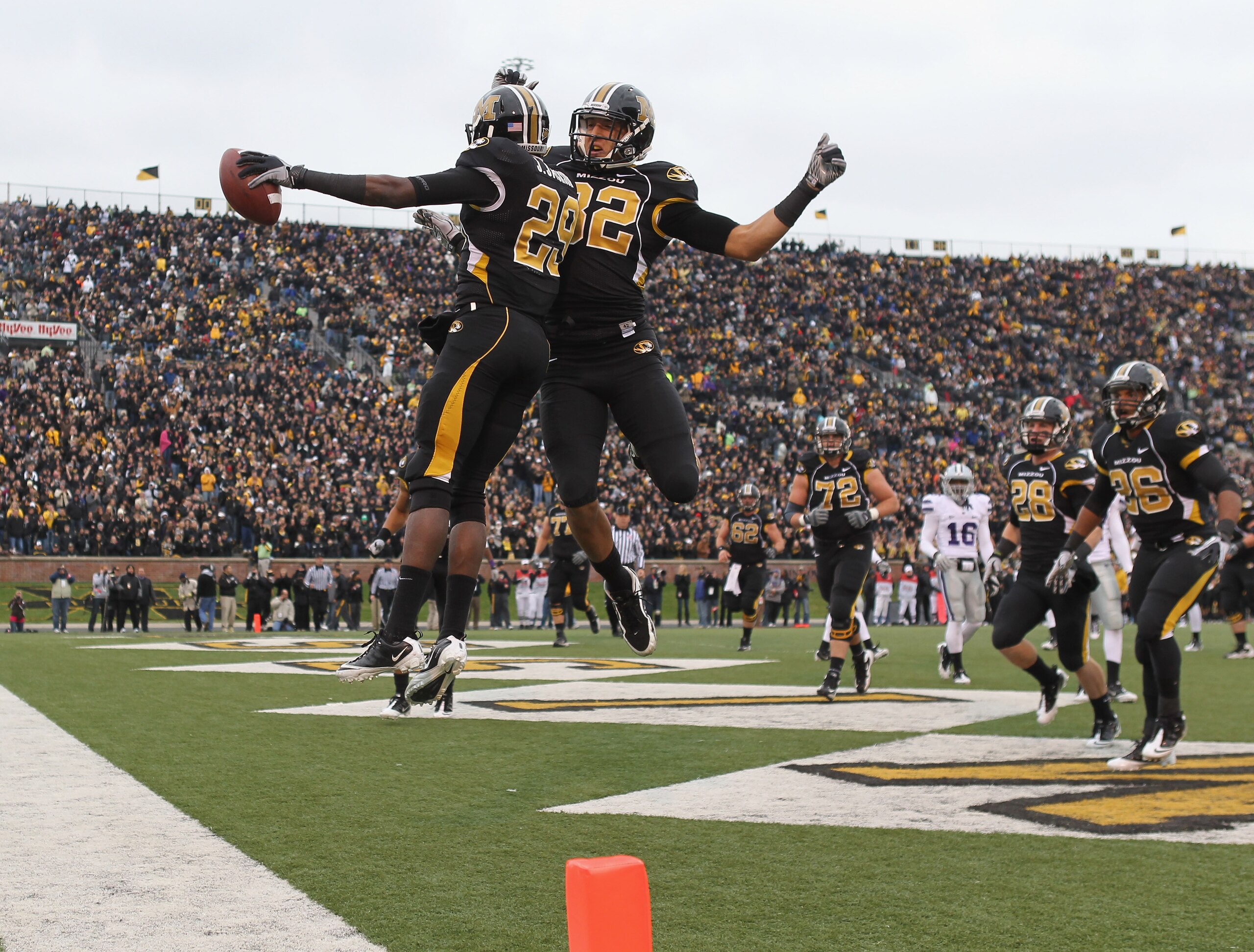 COLUMBIA, MO - NOVEMBER 13:  Michael Egnew #82  of the Missouri Tigers congratulates Jerrell Jackson #29 with a chest bump after Jackson carried for a touchdown during the game against the Kansas State Wildcats on November 13, 2010 at Faurot Field/Memoria