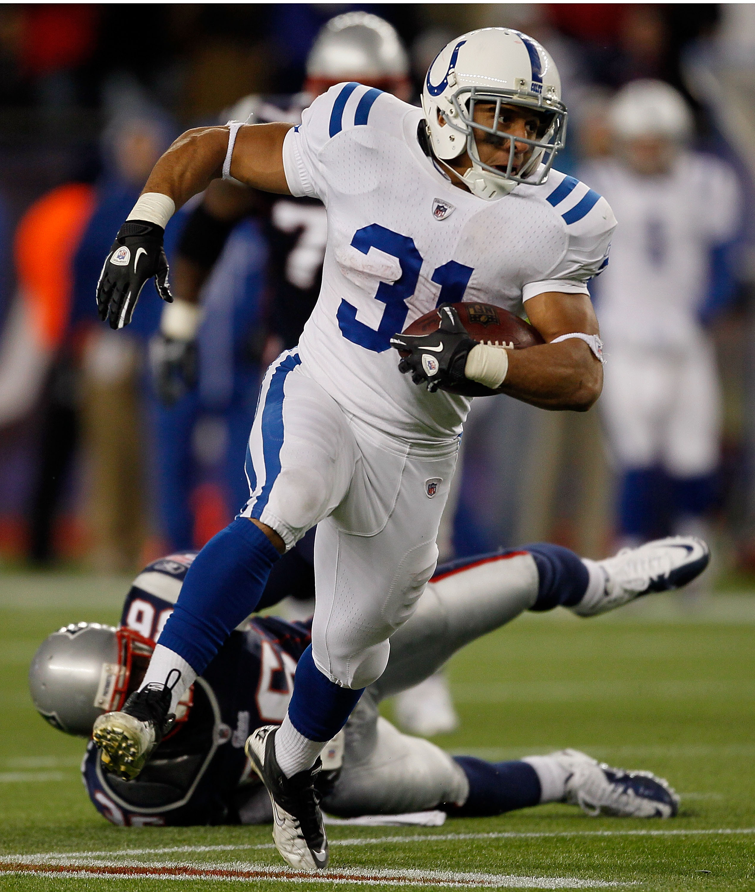 FOXBORO, MA - NOVEMBER 21:   Donald Brown #31  of the Indianapolis Colts runs against the New England Patriots at Gillette Stadium on November 21, 2010 in Foxboro, Massachusetts. (Photo by Jim Rogash/Getty Images)