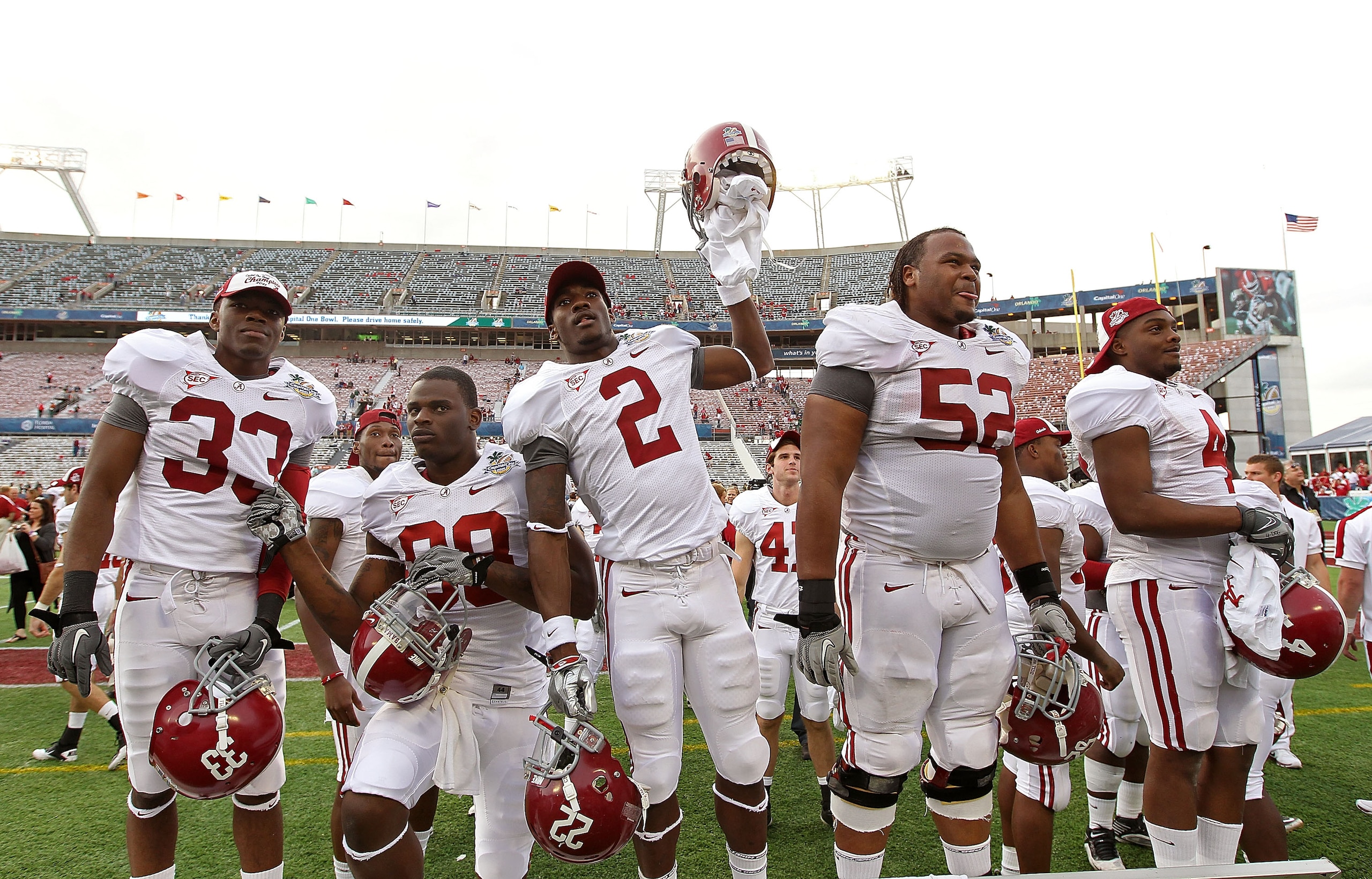 ORLANDO, FL - JANUARY 01:  Players from the Alabama Crimson Tide greet fans after winning the Capitol One Bowl against the Michigan State Spartans at the Florida Citrus Bowl on January 1, 2011 in Orlando, Florida.  (Photo by Mike Ehrmann/Getty Images)