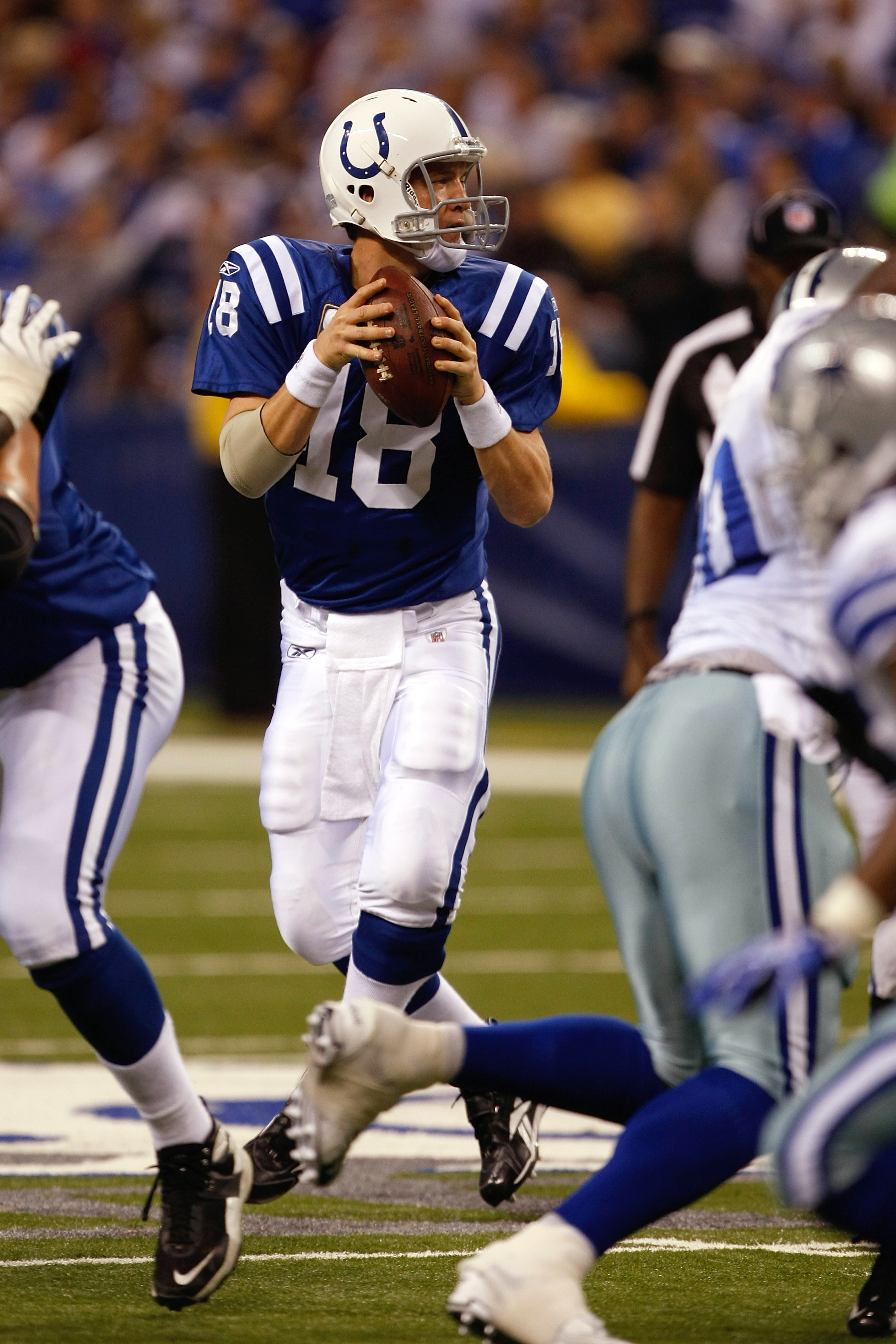INDIANAPOLIS, IN - DECEMBER 05: Peyton Manning #18 of the Indianapolis Colts drops back to pass against the Dallas Cowboys at Lucas Oil Stadium on December 5, 2010 in Indianapolis, Indiana.  (Photo by Scott Boehm/Getty Images)