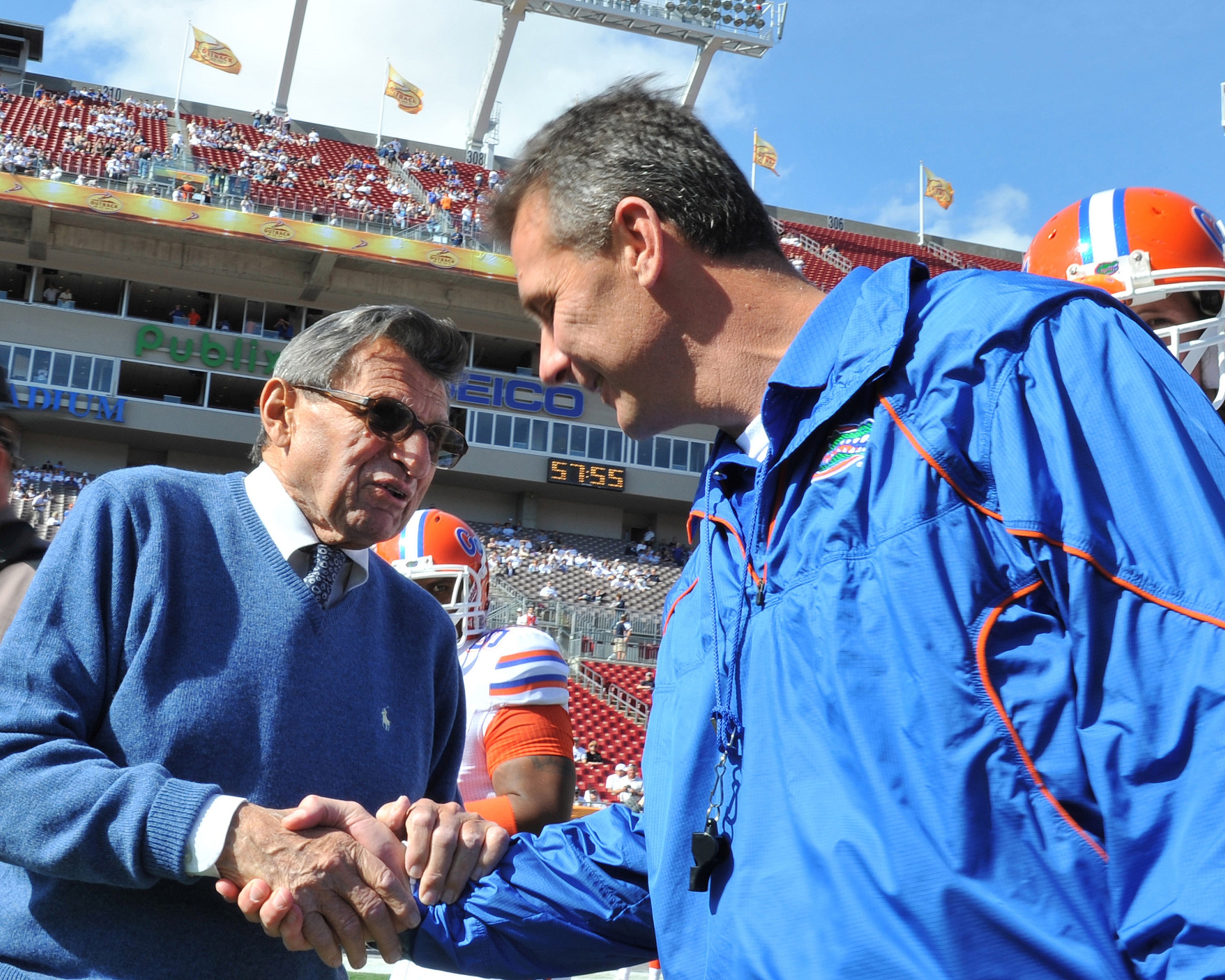 TAMPA, FL - JANUARY 1:  Coach Joe Paterno of the Penn State Nittany Lions greets coach Urban Meyer of the Florida Gators before play in the 25th Outback Bowl at Raymond James Stadium January 1, 2011 in Tampa, Florida.  (Photo by Al Messerschmidt/Getty Ima