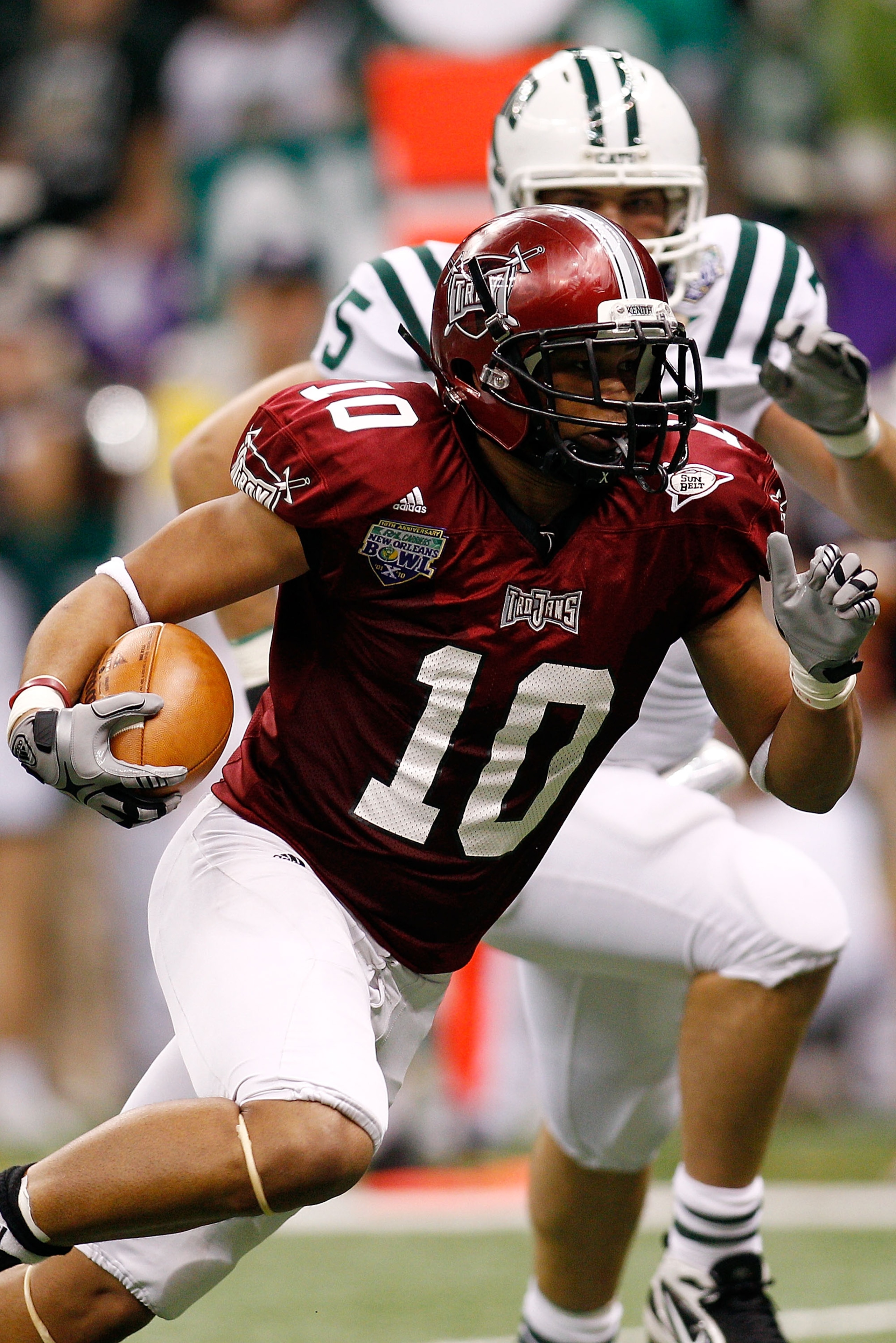 NEW ORLEANS, LA - DECEMBER 18:  Gill Tebiarus #10 of the Troy University Trojans scores a touchdown during the game against the Ohio University Bobcats during the R&L Carriers New Orleans Bowl at the Louisiana Superdome on December 18, 2010 in New Orleans