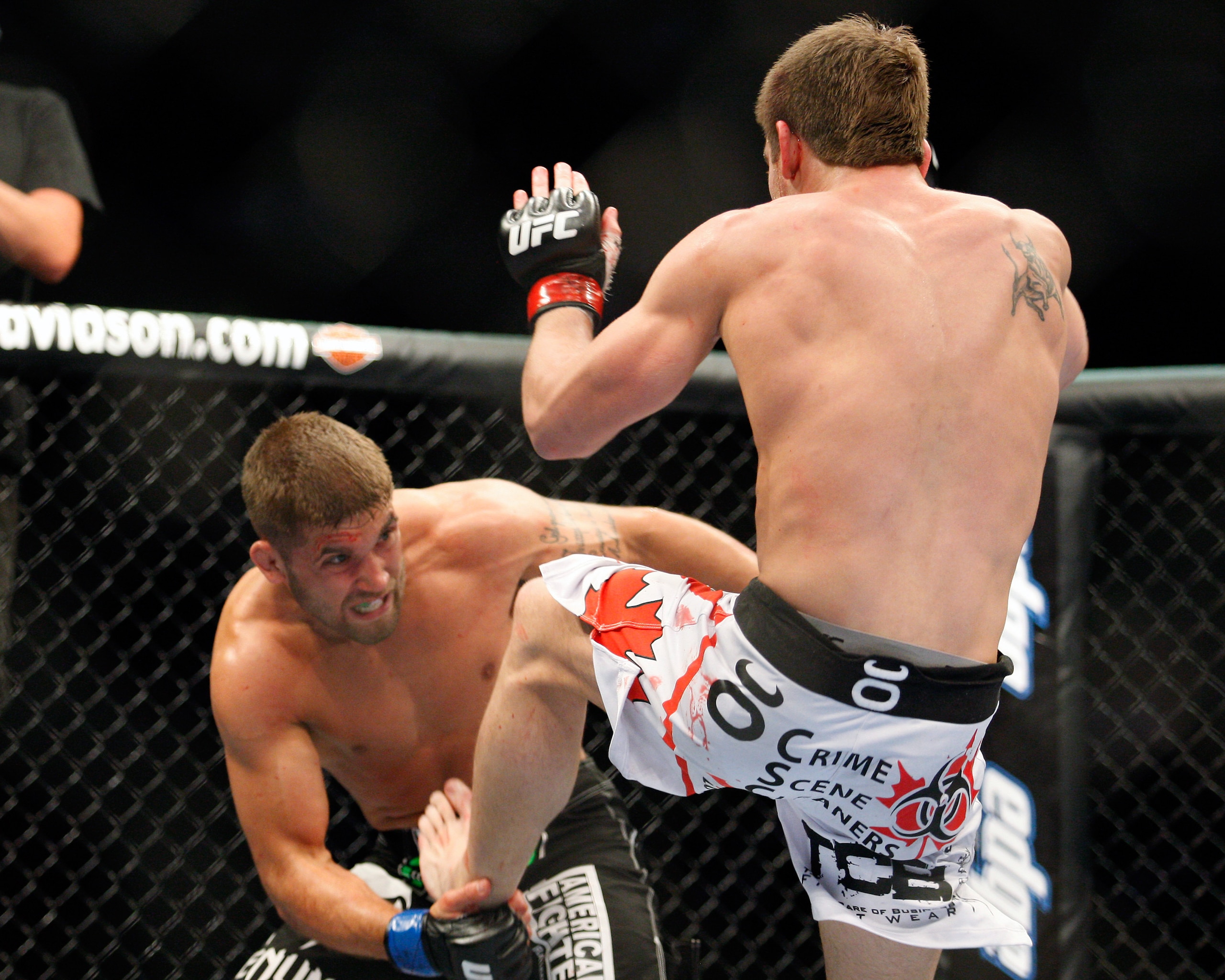 MONTREAL- MAY 8: Sam Stout (R) kicks Jeremy Stephens in their lightweight 'swing' bout at UFC 113 at Bell Centre on May 8, 2010 in Montreal, Quebec, Canada.  (Photo by Richard Wolowicz/Getty Images)