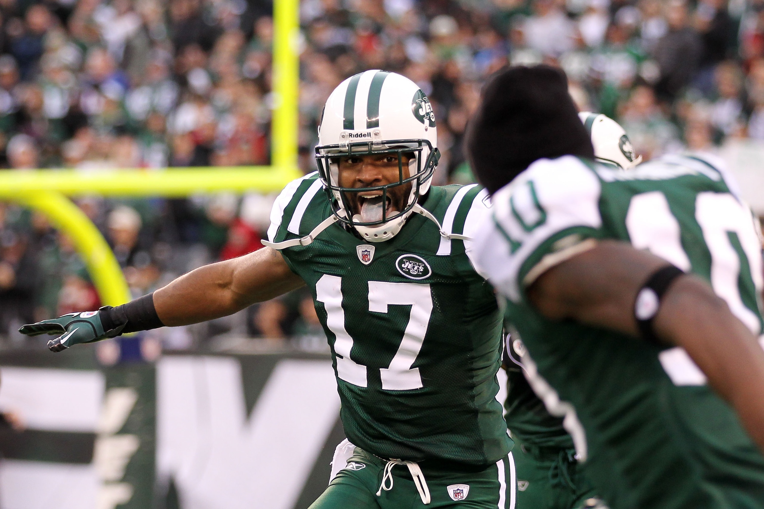 EAST RUTHERFORD, NJ - JANUARY 02:  Braylon Edwards #17 and Santonio Holmes #10 of the New York Jets celebrate Edwards' third quarter touchdown against the Buffalo Bills at New Meadowlands Stadium on January 2, 2011 in East Rutherford, New Jersey.  (Photo
