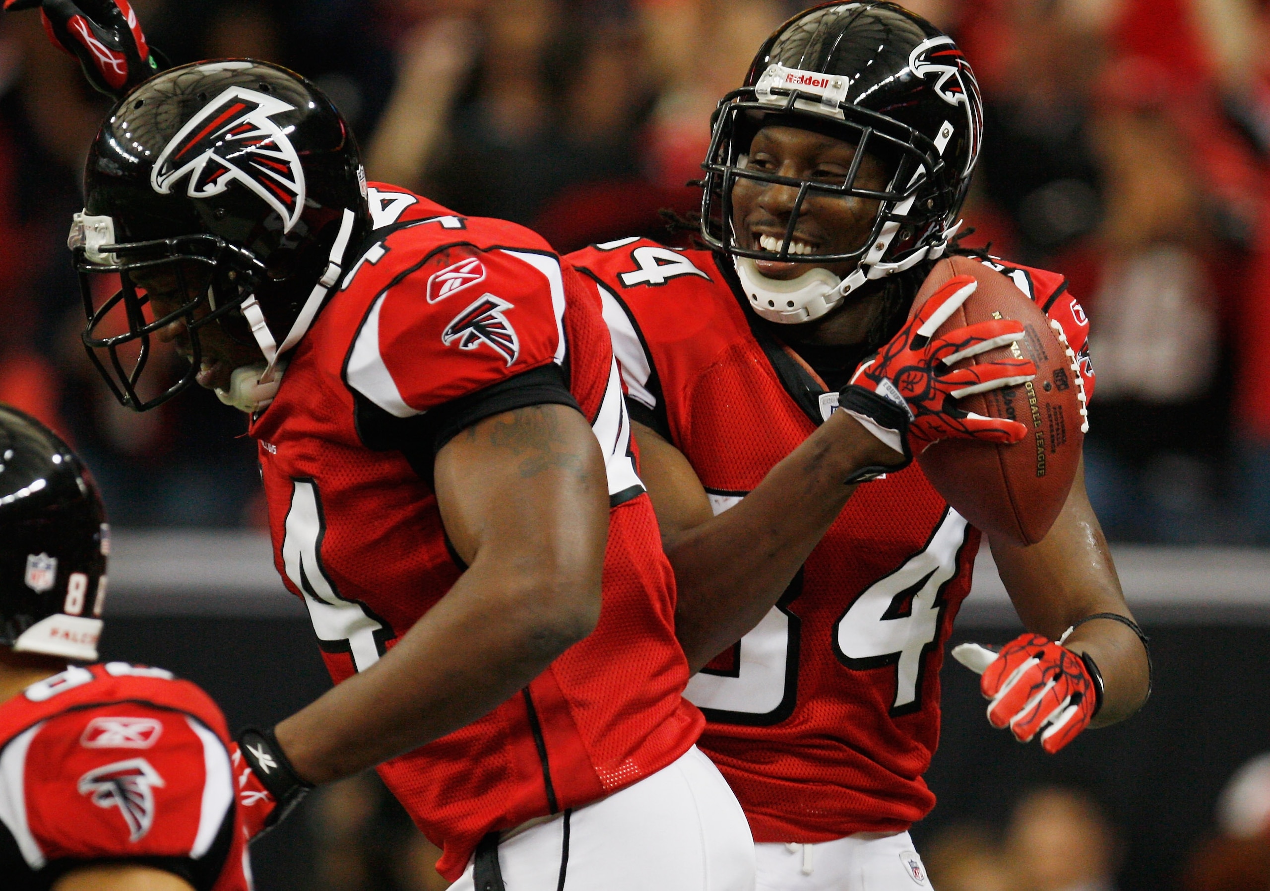ATLANTA, GA - JANUARY 02:  Roddy White #84 and Jason Snelling #44 of the Atlanta Falcons celebrate after White's second quarter touchdown during the game against the Carolina Panthers at the Georgia Dome on January 2, 2011 in Atlanta, Georgia.  (Photo by