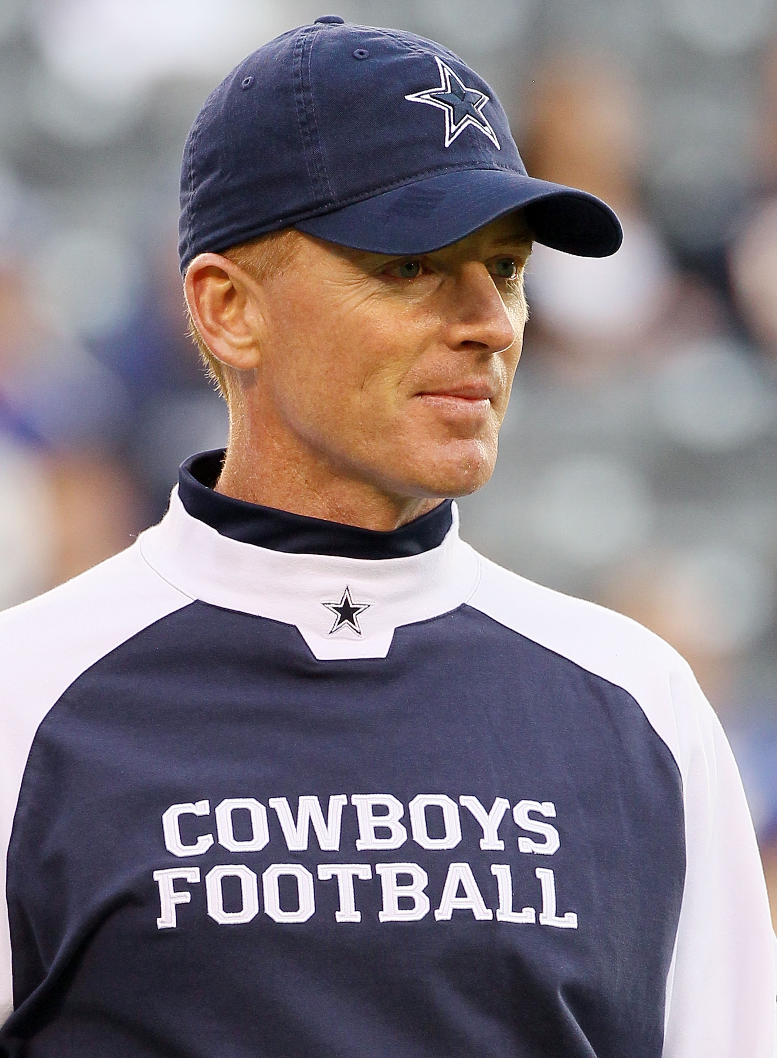 EAST RUTHERFORD, NJ - NOVEMBER 14:  Head coach Jason Garrett of the Dallas Cowboys looks on as his team warms up prior to playing against the New York Giants on November 14, 2010 at the New Meadowlands Stadium in East Rutherford, New Jersey.  (Photo by Ji