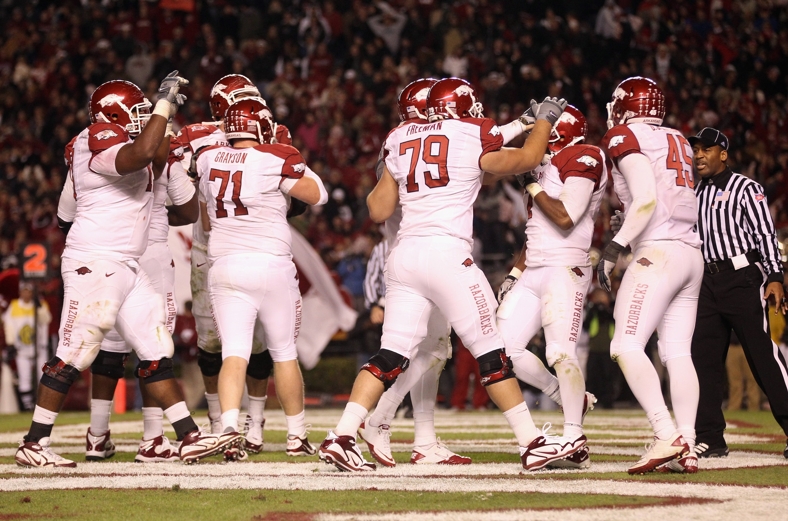 COLUMBIA, SC - NOVEMBER 06: Knile Davis #7 of the Arkansas Razorbacks is congratulated by teammates after scoring a touchdown against the South Carolina Gamecocks during their game at Williams-Brice Stadium on November 6, 2010 in Columbia, South Carolina COLUMBIA, SC - NOVEMBER 06: Knile Davis #7 of the Arkansas Razorbacks is congratulated by teammates after scoring a touchdown against the South Carolina Gamecocks during their game at Williams-Brice Stadium on November 6, 2010 in Columbia, South Carolina