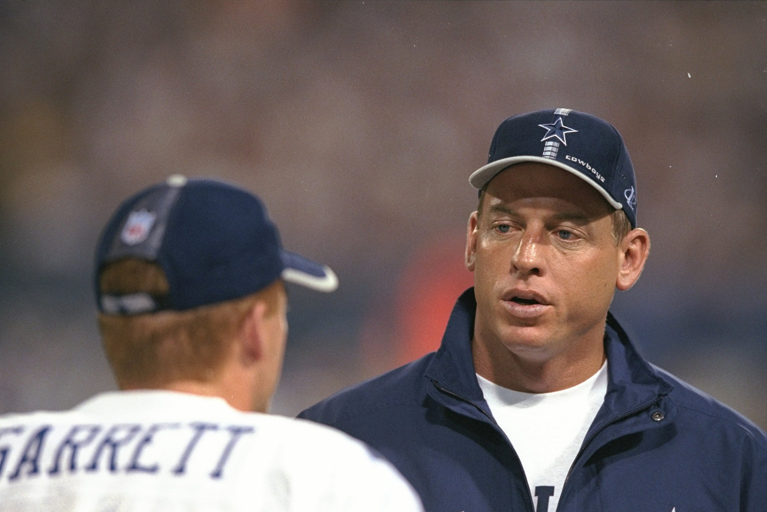 21 Sep 1998:   Quarterback Troy Aikman #8 for the Dallas Cowboys talks to teammate  Jason Garrett  during the game against the New York Giants at Giant Stadium in East Rutherford, New York. The Cowboys defeated the Giants 34- 7Mandatory Credit: Ezra O. Sh