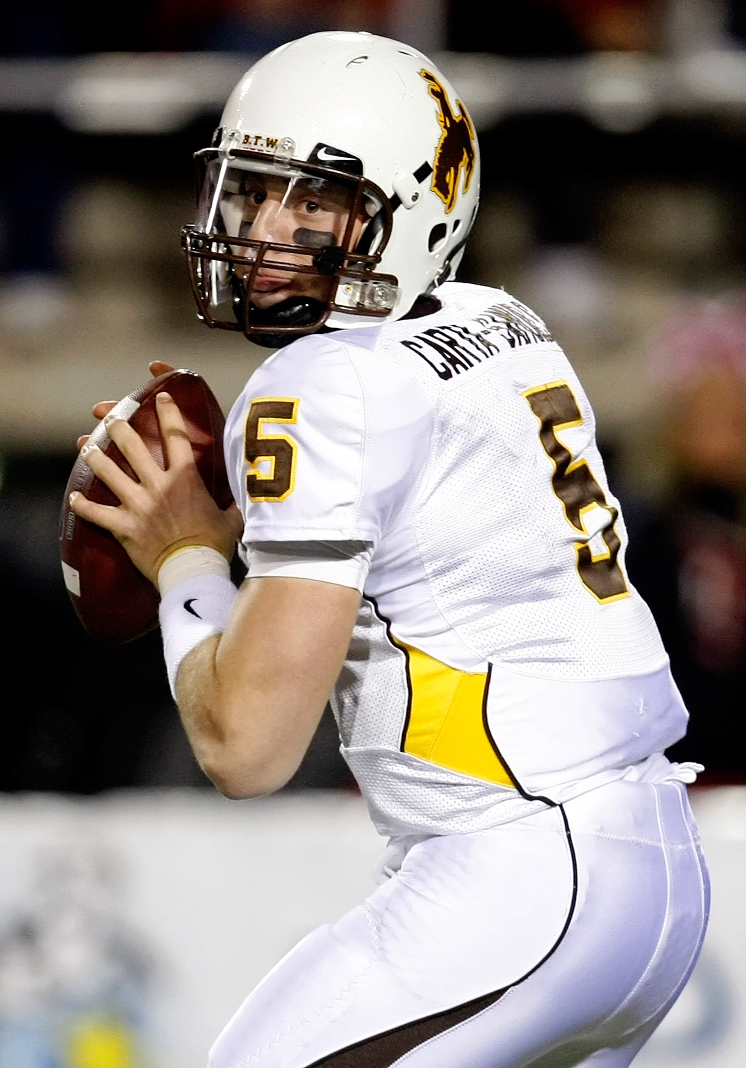 LAS VEGAS - NOVEMBER 13:  Quarterback Austyn Carta-Samuels #5 of the Wyoming Cowboys looks to pass during a game against the UNLV Rebels at Sam Boyd Stadium November 13, 2010 in Las Vegas, Nevada. UNLV won 42-16.  (Photo by Ethan Miller/Getty Images)
