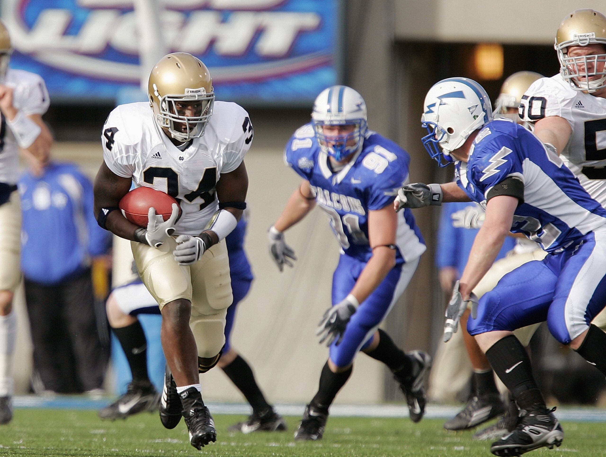 AIR FORCE ACADEMY, CO - NOVEMBER 11:  James Aldridge #34 of the Notre Dame Fighting Irish carries the ball against Joe Keller #42 of the Air Force Falcons on November 11, 2006 at Falcon Stadium on the Air Force Academy near Colorado Springs, Colorado.  (P