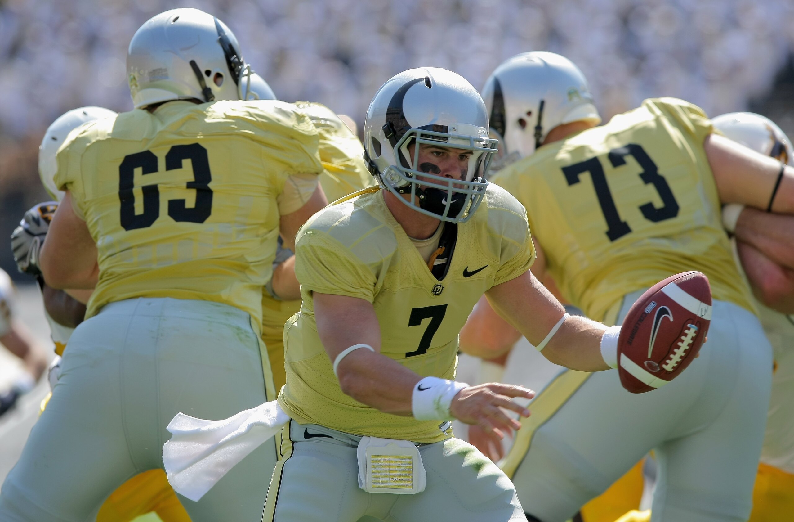 BOULDER, CO - SEPTEMBER 19:  Quarterback Cody Hawkins #7 of the Colorado Buffaloes hands off the ball against the Wyoming Cowboys at Folsom Field on September 19, 2009 in Boulder, Colorado. The Buffaloes defeated the Cowboys 24-0.  (Photo by Doug Pensinge