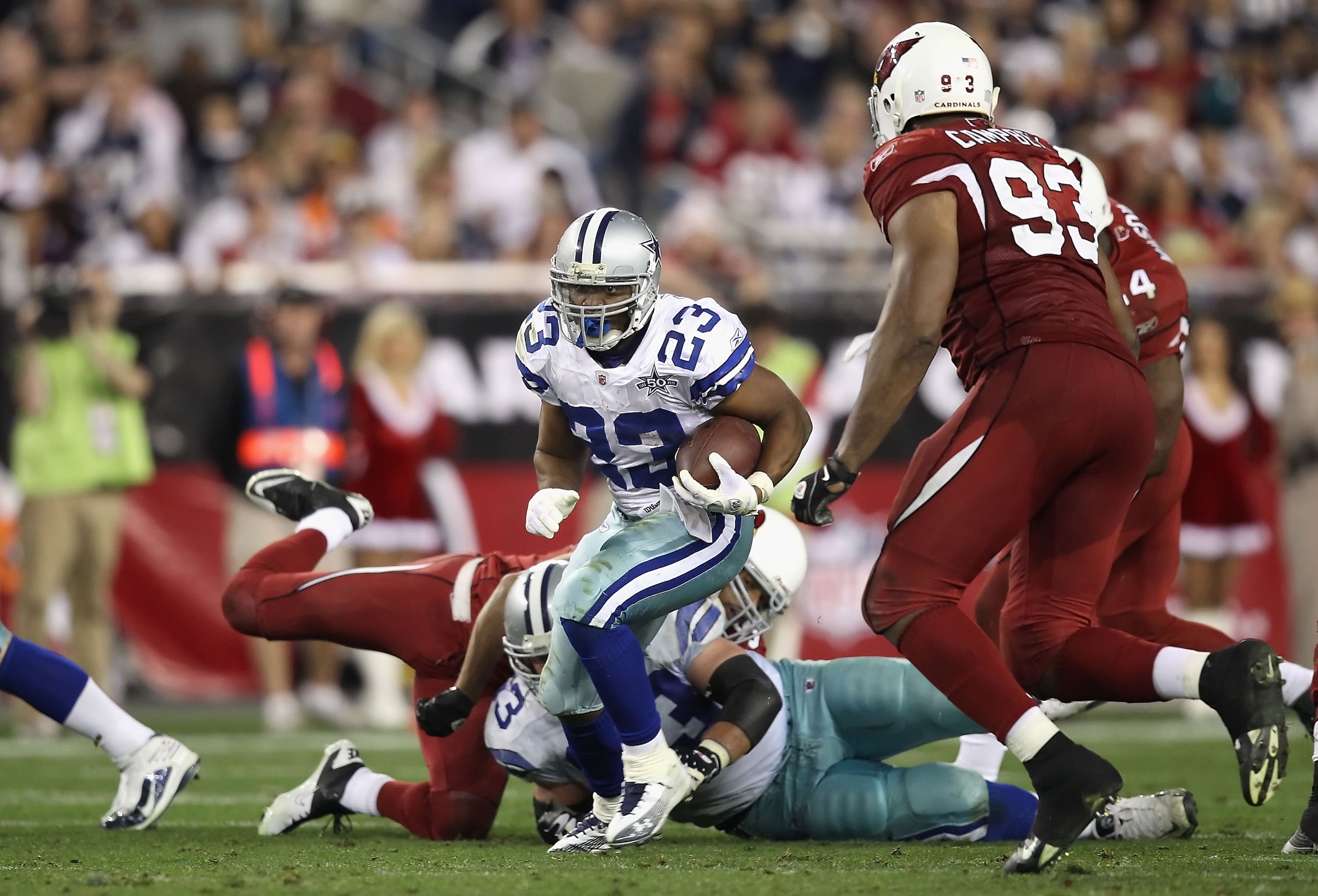 GLENDALE, AZ - DECEMBER 25:  Runningback Tashard Choice #23 of the Dallas Cowboys rushes the football during the NFL game against the Arizona Cardinals at the University of Phoenix Stadium on December 25, 2010 in Glendale, Arizona.  The Cardinals defeated