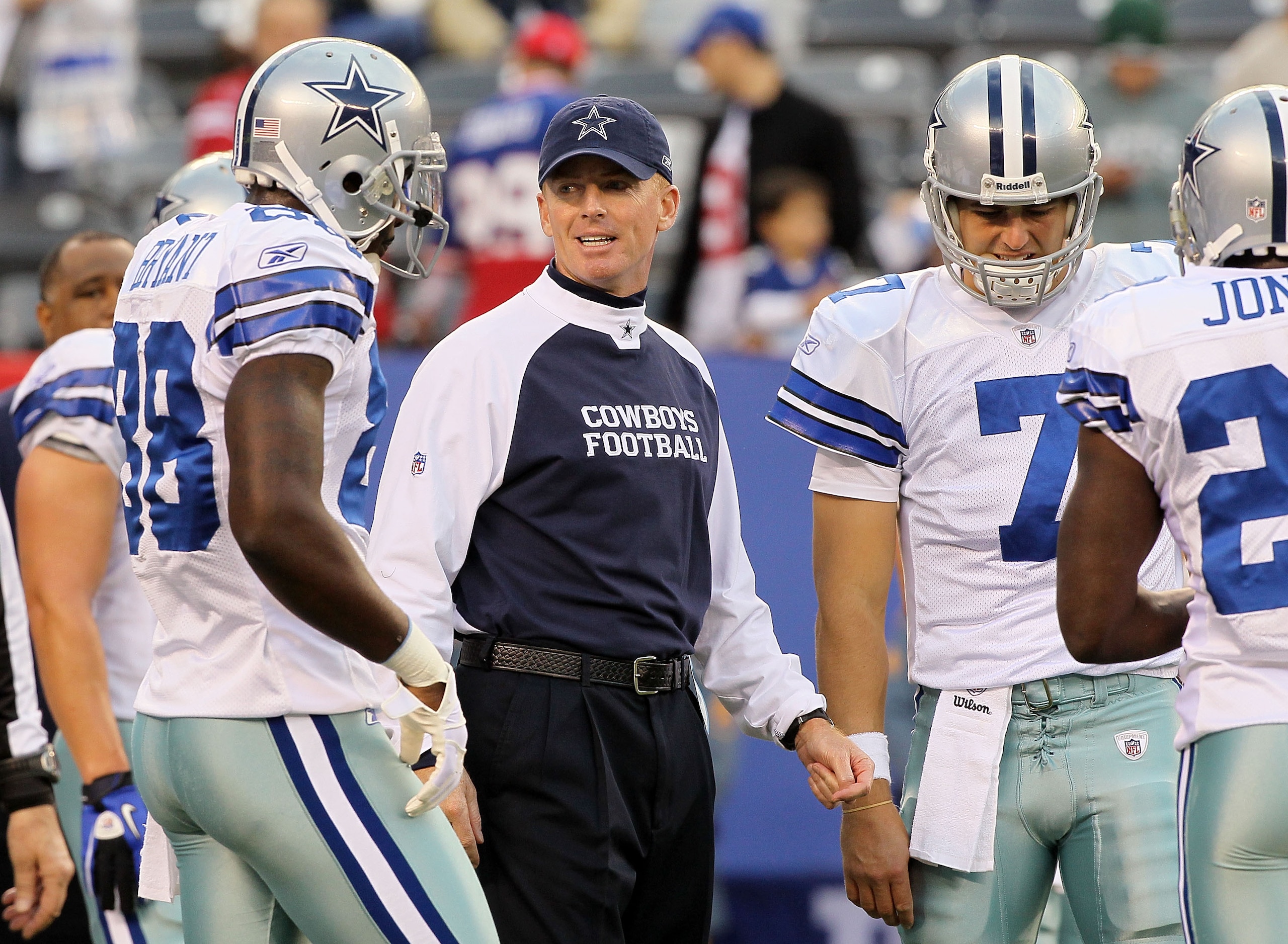 EAST RUTHERFORD, NJ - NOVEMBER 14:  Head coach Jason Garrett of the Dallas Cowboys works  with his team as they warm up prior to playing against the New York Giants on November 14, 2010 at the New Meadowlands Stadium in East Rutherford, New Jersey.  (Phot