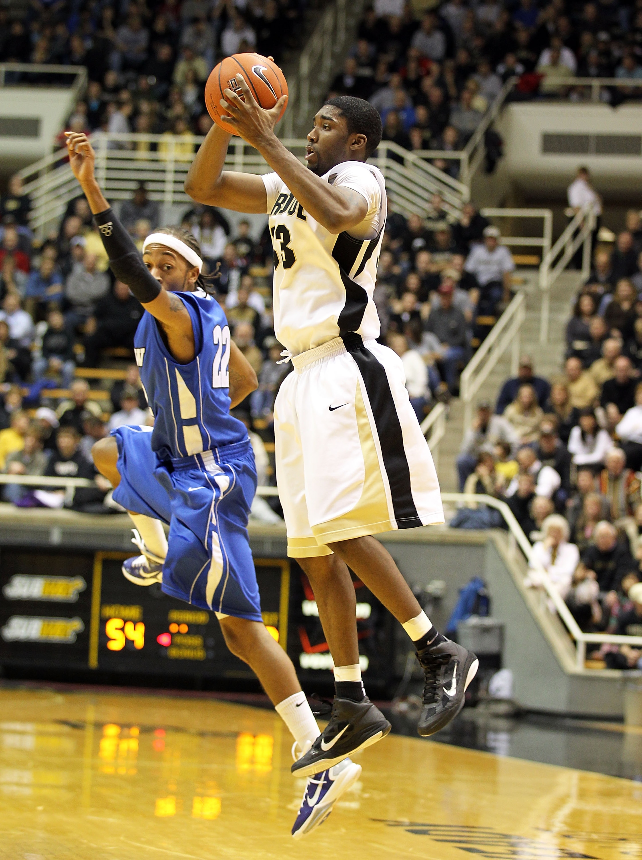 WEST LAFAYETTE, IN - DECEMBER 21: E ' Twaun Moore #33 of the Purdue Boilermakers grabs a loose ball while defended by Jeremy Mixon #22 of the IPFW Mastodons during the game at Mackey Arena on December 21, 2010 in West Lafayette, Indiana. (Photo by Andy WEST LAFAYETTE, IN - DECEMBER 21: E ' Twaun Moore #33 of the Purdue Boilermakers grabs a loose ball while defended by Jeremy Mixon #22 of the IPFW Mastodons during the game at Mackey Arena on December 21, 2010 in West Lafayette, Indiana. (Photo by Andy