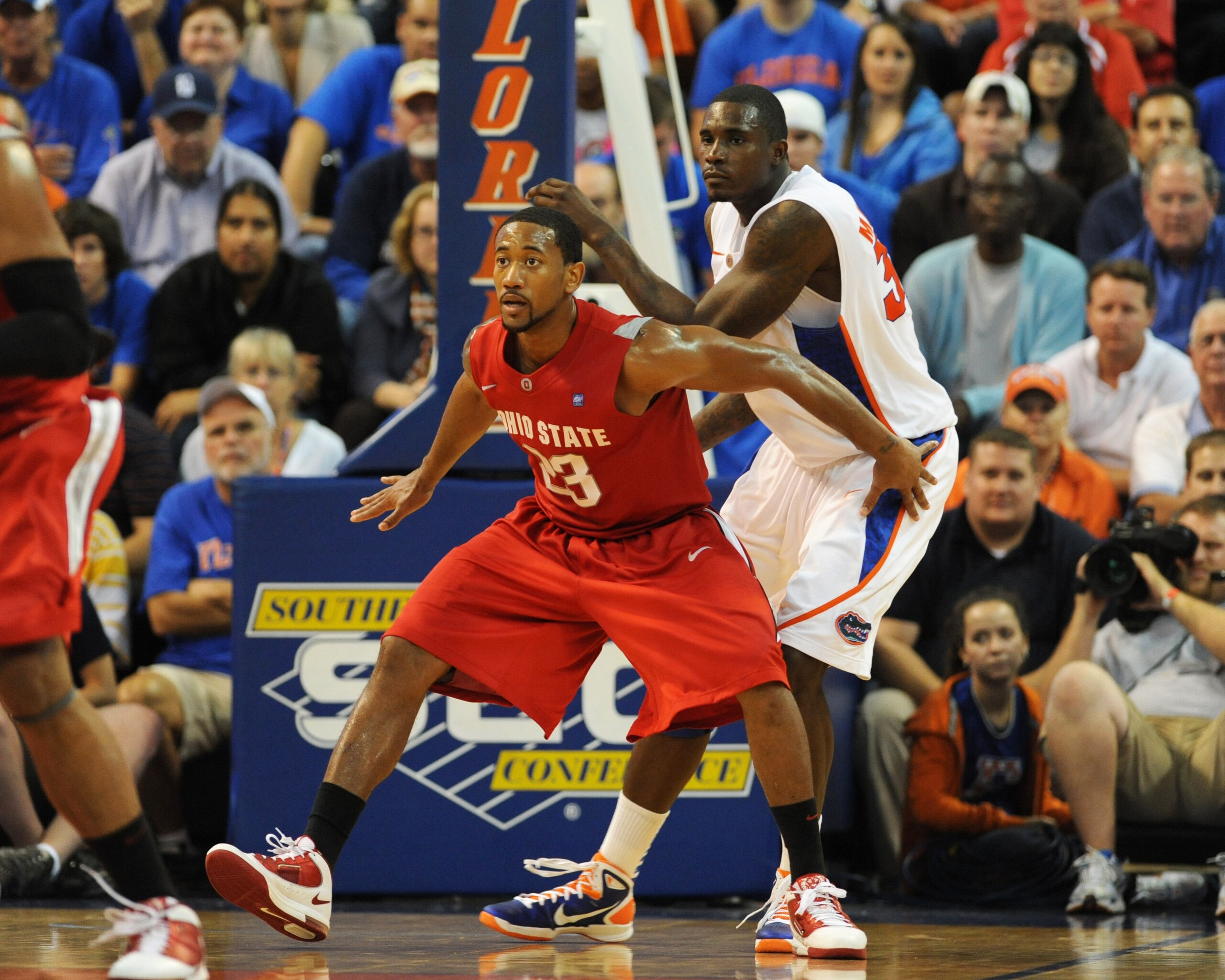 GAINESVILLE, FL - NOVEMBER 16: Guard David Lighty #23 of the Ohio State Buckeyes sets on defense against the Florida Gators November 16, 2010 at the Stephen C. O'Connell Center in Gainesville, Florida. (Photo by Al Messerschmidt/Getty Images) GAINESVILLE, FL - NOVEMBER 16: Guard David Lighty #23 of the Ohio State Buckeyes sets on defense against the Florida Gators November 16, 2010 at the Stephen C. O'Connell Center in Gainesville, Florida. (Photo by Al Messerschmidt/Getty Images)