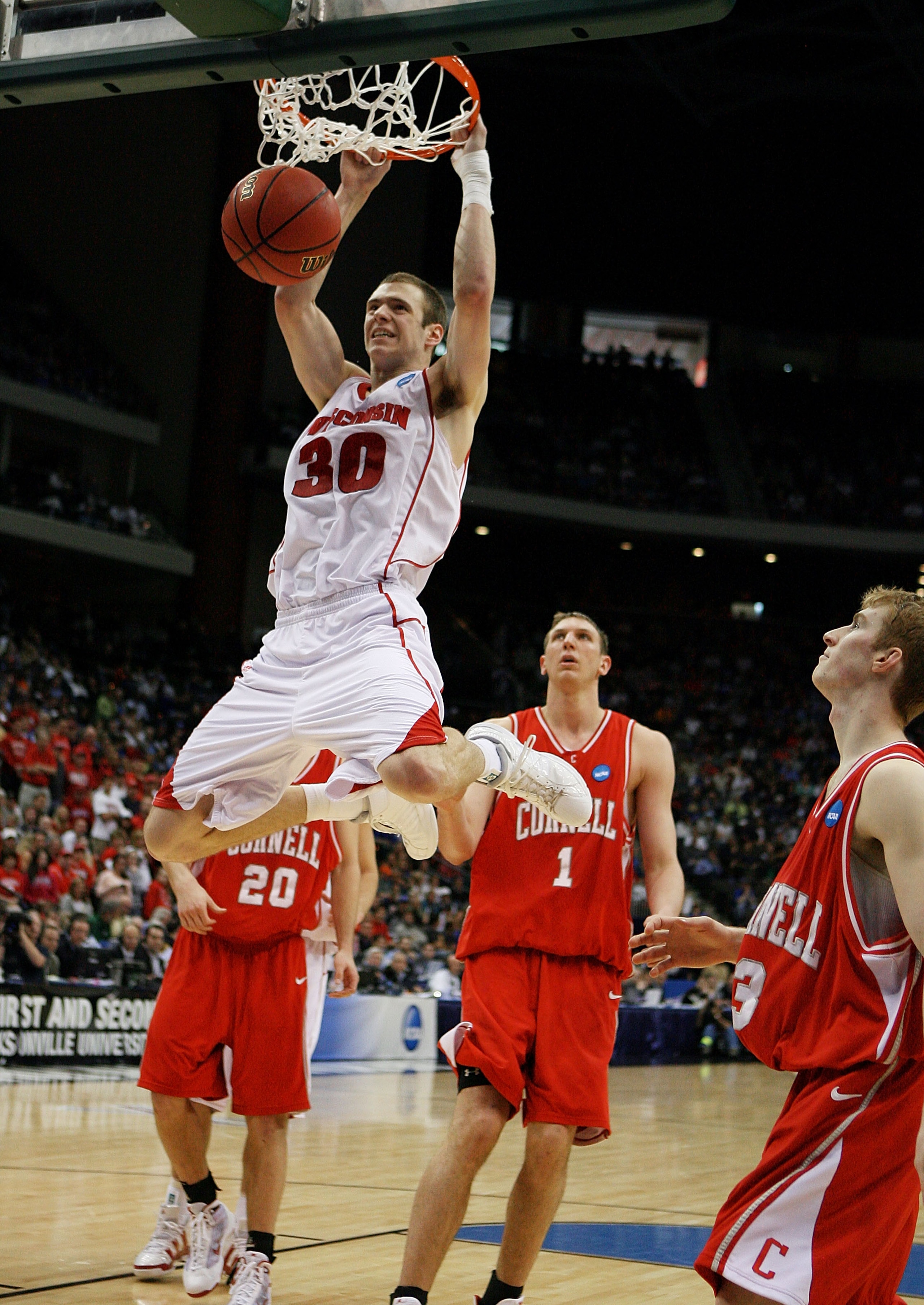 JACKSONVILLE, FL - MARCH 21: Jon Leuer #30 of the Wisconsin Badgers dunks against the Cornell Big Red during the second round of the 2010 NCAA men's basketball tournament at Jacksonville Veteran's Memorial Arena on March 21, 2010 in Jacksonville, Florida. JACKSONVILLE, FL - MARCH 21: Jon Leuer #30 of the Wisconsin Badgers dunks against the Cornell Big Red during the second round of the 2010 NCAA men's basketball tournament at Jacksonville Veteran's Memorial Arena on March 21, 2010 in Jacksonville, Florida.
