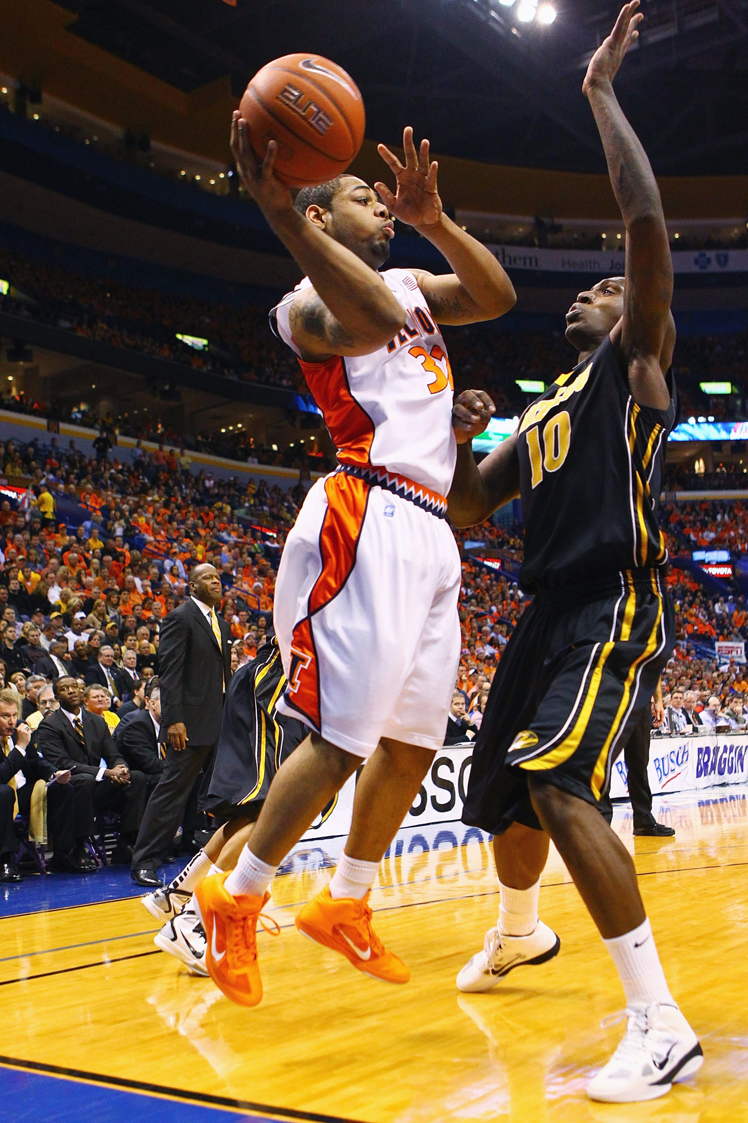 ST. LOUIS, MO - DECEMBER 22: Demetri McCamey #32 of the Illinois Fighting Illini passes the ball against Ricardo Ratliffe #10 of the Missouri Tigers during the Busch Braggin' Rights game at the Scottrade Center on December 22, 2010 in St. Louis, Missouri. ST. LOUIS, MO - DECEMBER 22: Demetri McCamey #32 of the Illinois Fighting Illini passes the ball against Ricardo Ratliffe #10 of the Missouri Tigers during the Busch Braggin' Rights game at the Scottrade Center on December 22, 2010 in St. Louis, Missouri.