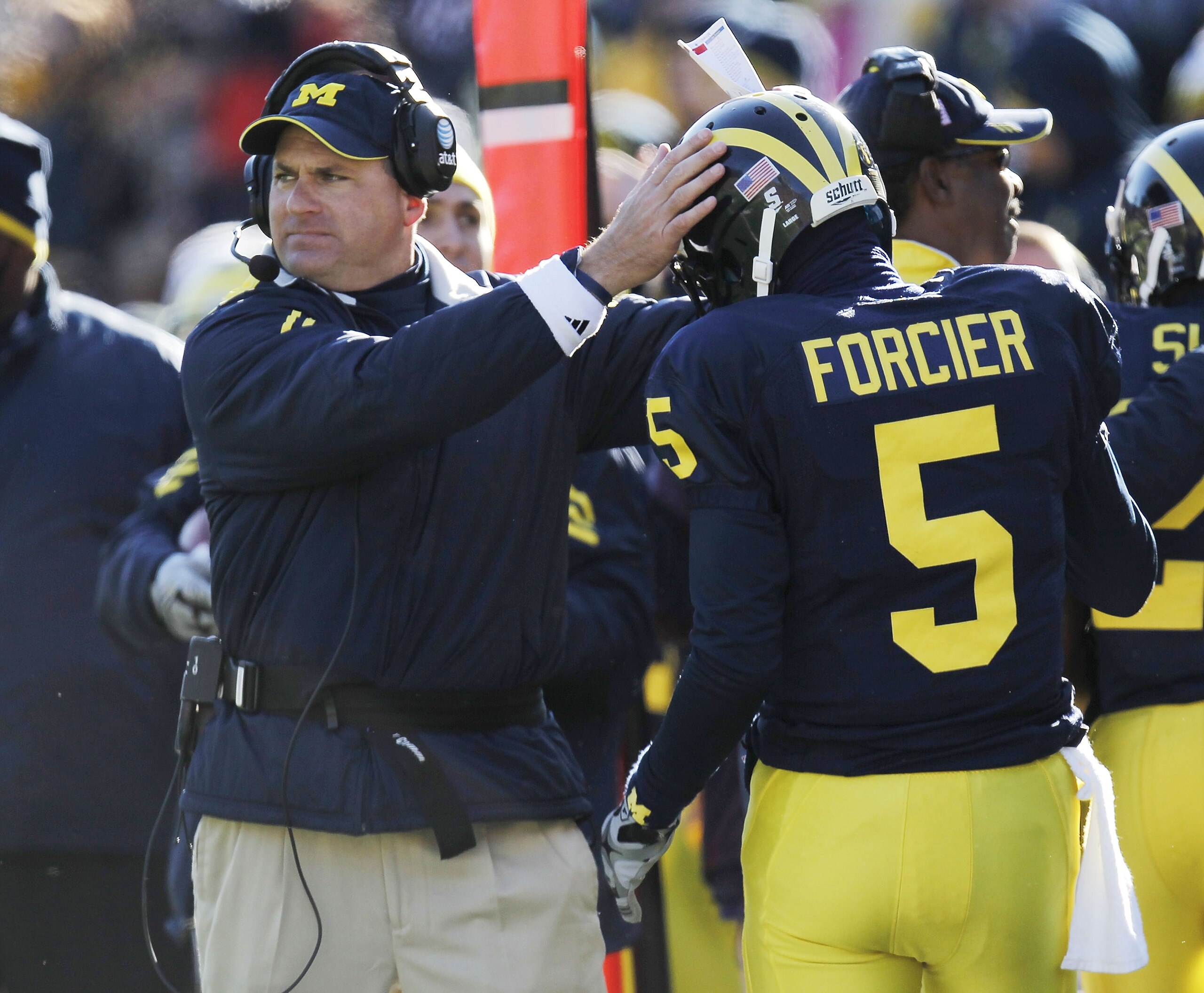 ANN ARBOR, MI - NOVEMBER 06: Tate Forcier #5 of the Michigan Wolverines is congratulated by head coach Rich Rodriguez after scoring an overtime touchdown while playing the Illinios Fighting Illini at Michigan Stadium on November 6, 2010 in Ann Arbor, Mic ANN ARBOR, MI - NOVEMBER 06: Tate Forcier #5 of the Michigan Wolverines is congratulated by head coach Rich Rodriguez after scoring an overtime touchdown while playing the Illinios Fighting Illini at Michigan Stadium on November 6, 2010 in Ann Arbor, Mic