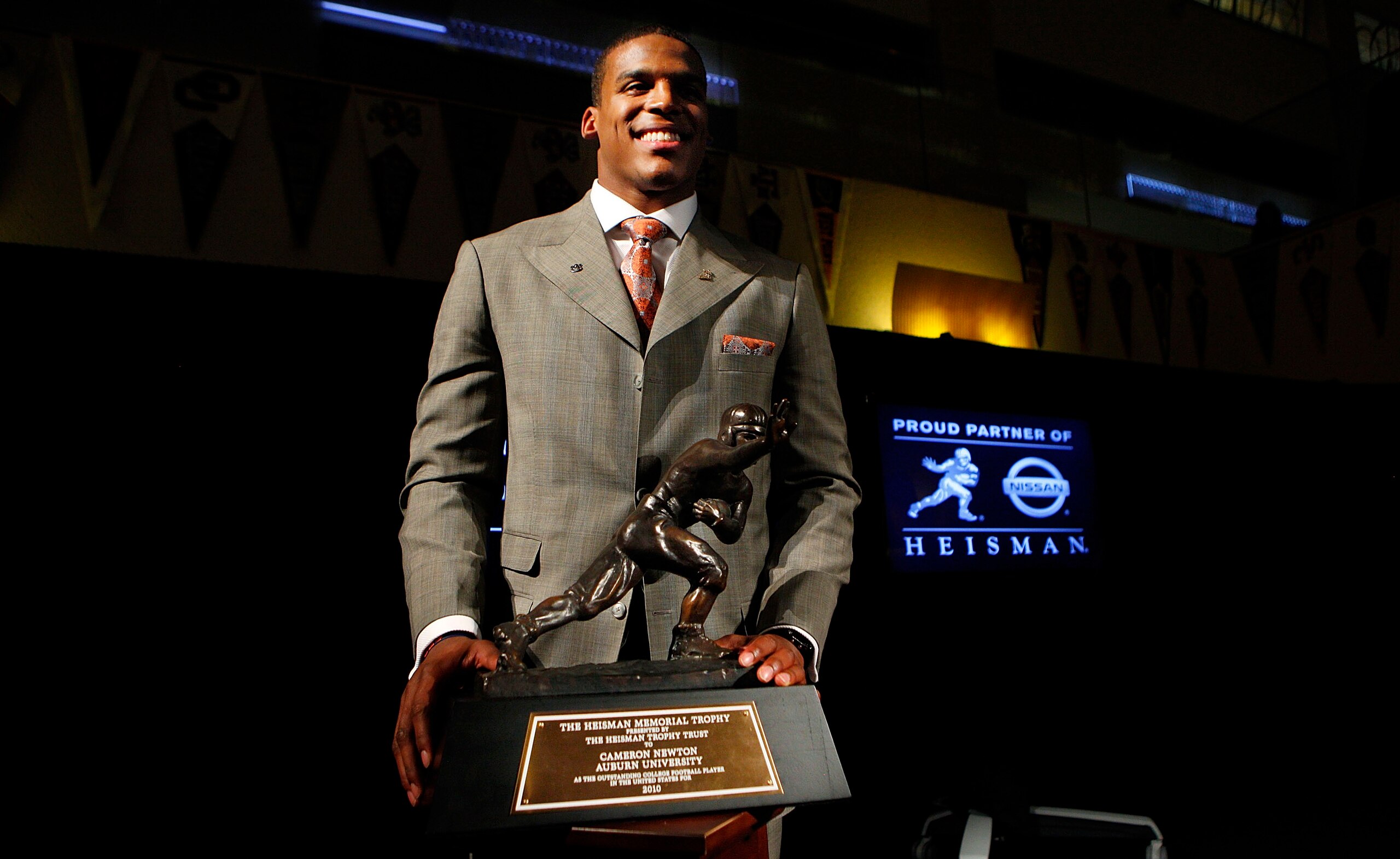 NEW YORK - DECEMBER 11: Cam Newton, quarterback of the Auburn University Tigers, poses with the 2010 Heisman Memorial Trophy Award on December 11, 2010 in New York City. (Photo by Jeff Zelevansky/Getty Images) NEW YORK - DECEMBER 11: Cam Newton, quarterback of the Auburn University Tigers, poses with the 2010 Heisman Memorial Trophy Award on December 11, 2010 in New York City. (Photo by Jeff Zelevansky/Getty Images)