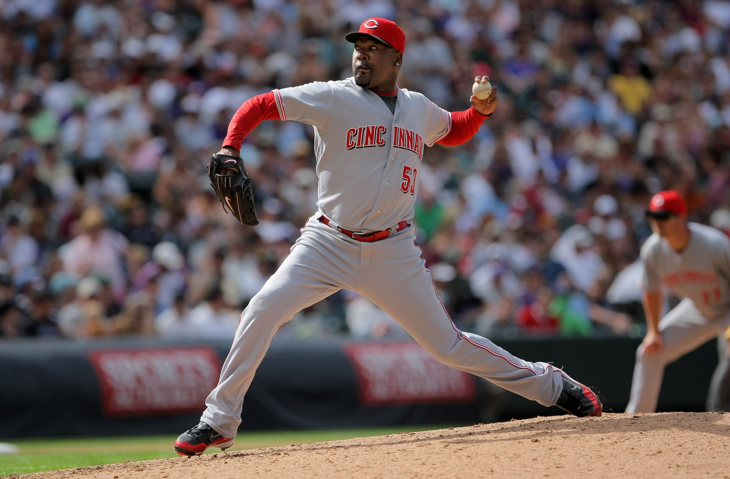 DENVER - SEPTEMBER 07:  Relief pitcher Arthur Rhodes #53 of the Cincinnati Reds delivers against the Colorado Rockies at Coors Field on September 7, 2009 in Denver, Colorado. The Rockies defeated the Reds 4-3.  (Photo by Doug Pensinger/Getty Images)