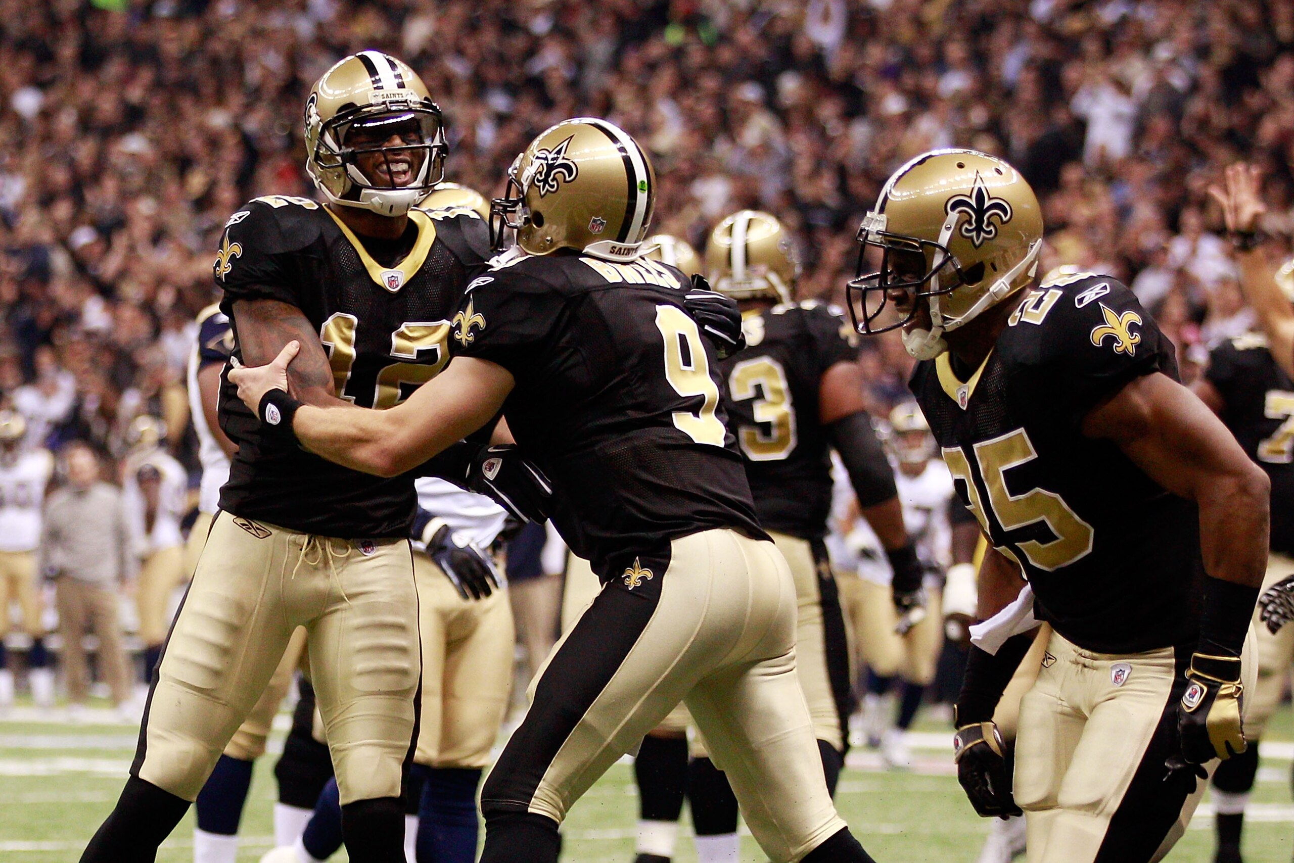 NEW ORLEANS, LA - DECEMBER 12: Drew Brees #9 and Marques Colston #12 of the New Orleans Saints celebrate after scoring a touchdown against the St. Louis Rams at the Louisiana Superdome on December 12, 2010 in New Orleans, Louisiana. The Saints defeated t NEW ORLEANS, LA - DECEMBER 12: Drew Brees #9 and Marques Colston #12 of the New Orleans Saints celebrate after scoring a touchdown against the St. Louis Rams at the Louisiana Superdome on December 12, 2010 in New Orleans, Louisiana. The Saints defeated t