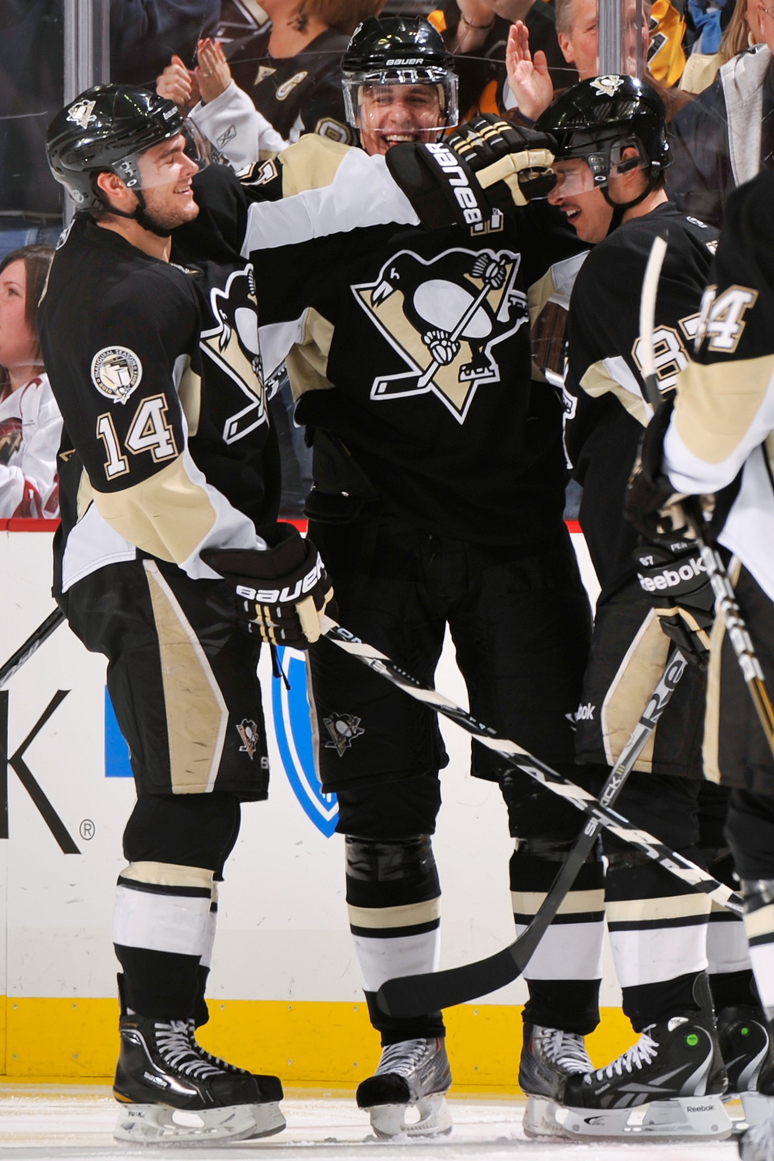 PITTSBURGH, PA - DECEMBER 20:  Chris Kunitz #14, Evgeni Malkin #71 and Sidney Crosby #87, all of the Pittsburgh Penguins, share a celebration after Malkin's second goal of the game against the Phoenix Coyotes in the second period on December 20, 2010 at C