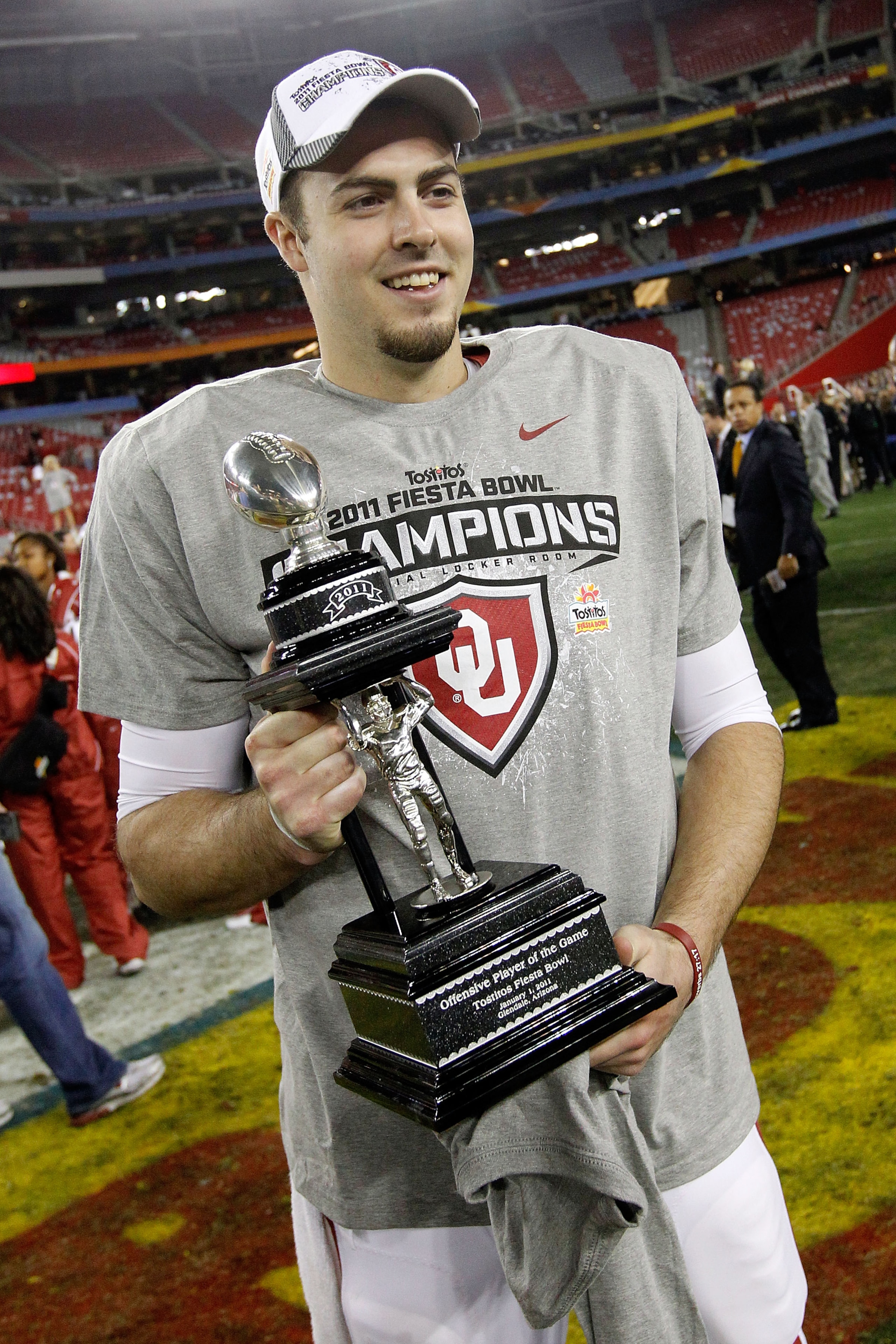 GLENDALE, AZ - JANUARY 01:  Quarterback Landry Jones #12 of the Oklahoma Sooners and offensive MVP celebrates the Sooners 48-20 victory against the Connecticut Huskies during the Tostitos Fiesta Bowl at the Universtity of Phoenix Stadium on January 1, 201