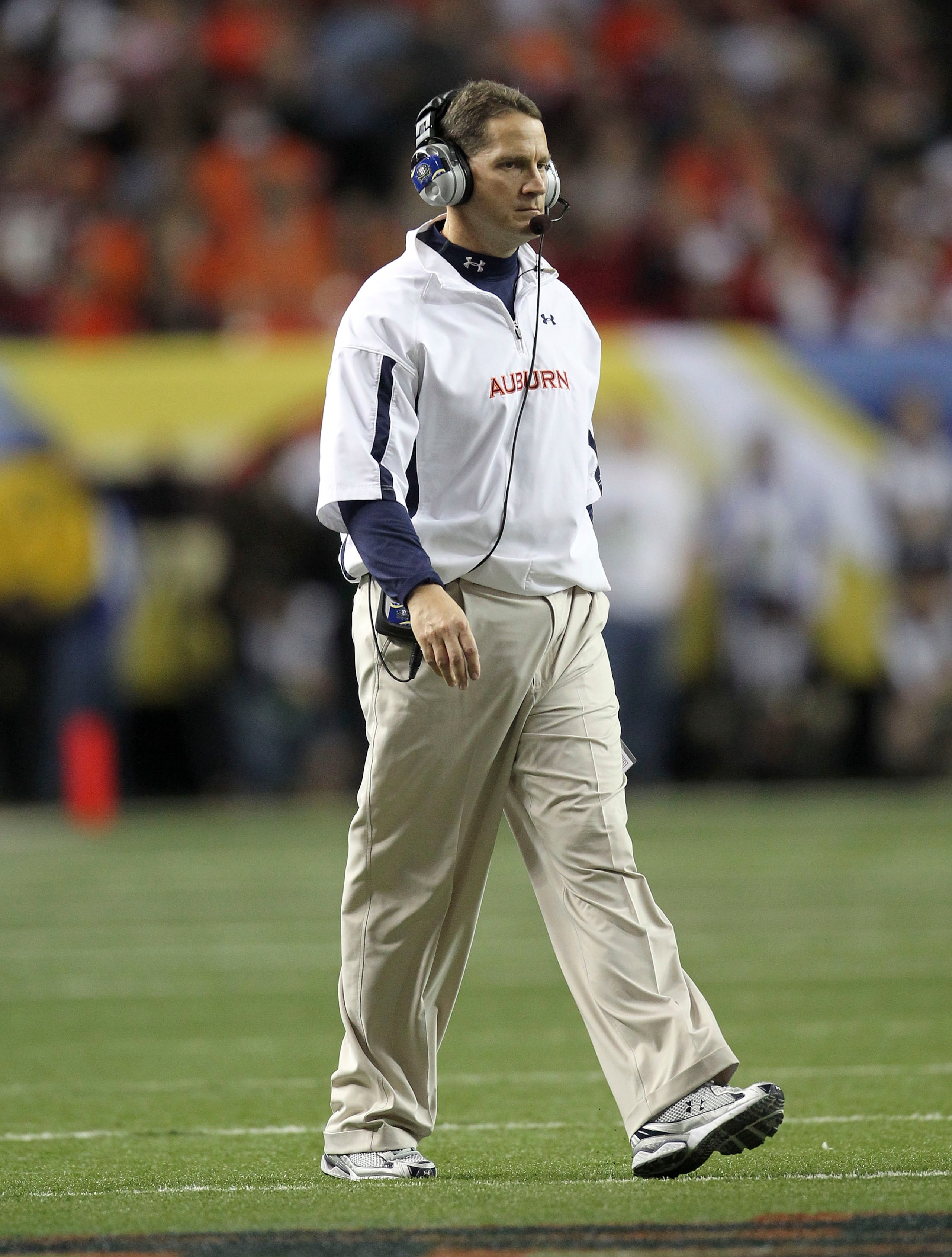 ATLANTA - DECEMBER 4:  Head coach Gene Chizik of the Auburn Tigers walks on the field during a timeout during the 2010 SEC Championship against the South Carolina Gamecocks at Georgia Dome on December 4, 2010 in Atlanta, Georgia. (Photo by Mike Zarrilli/G
