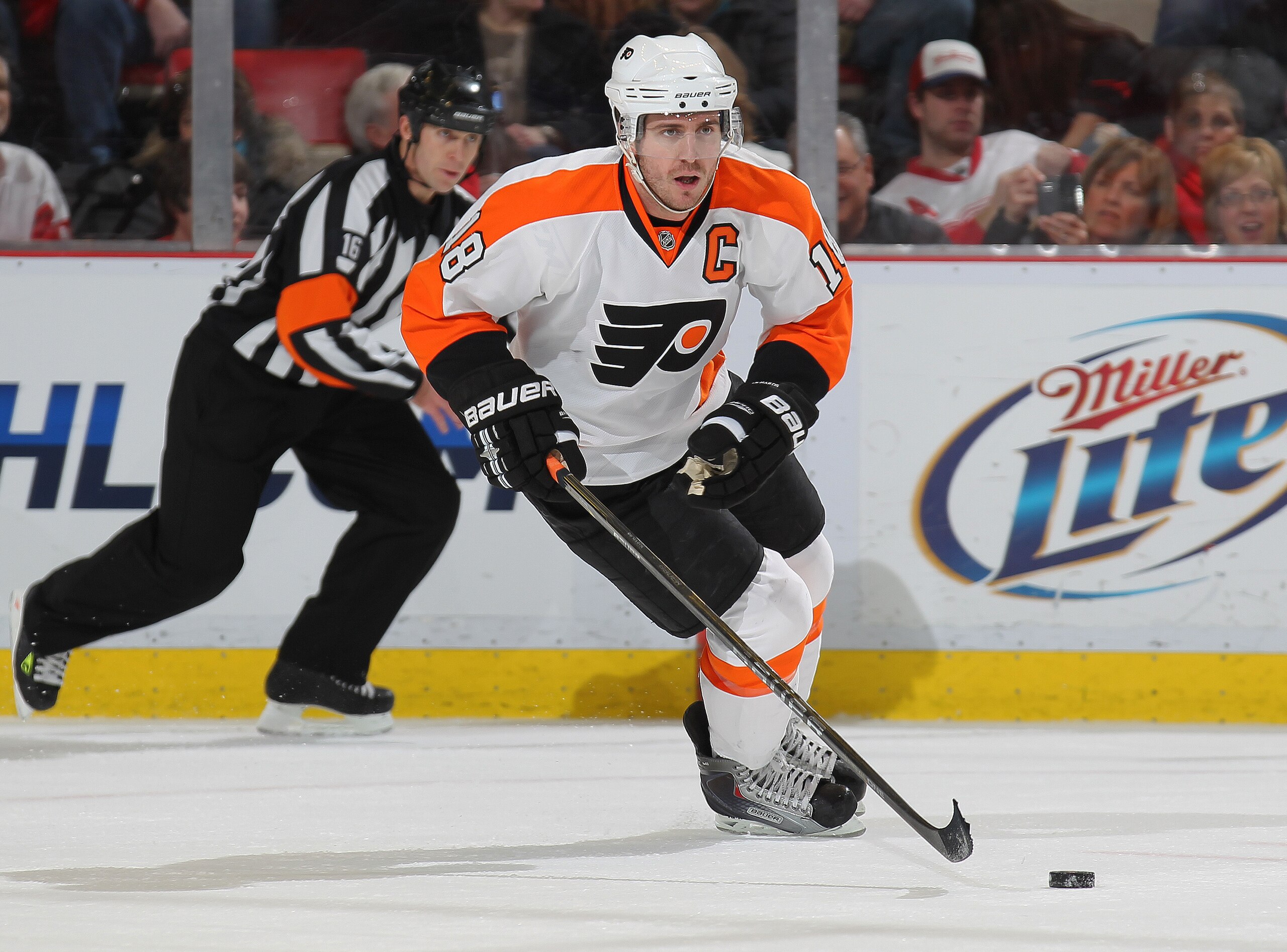 DETROIT, MI - JANUARY 2:  Mike Richards #18 of the Philadelphia Flyers skates up ice with the puck in a game against the Detroit Red Wings on January 2, 2011 at the Joe Louis Arena in Detroit, Michigan. The Flyers defeated the Wings 3-2. (Photo by Claus A