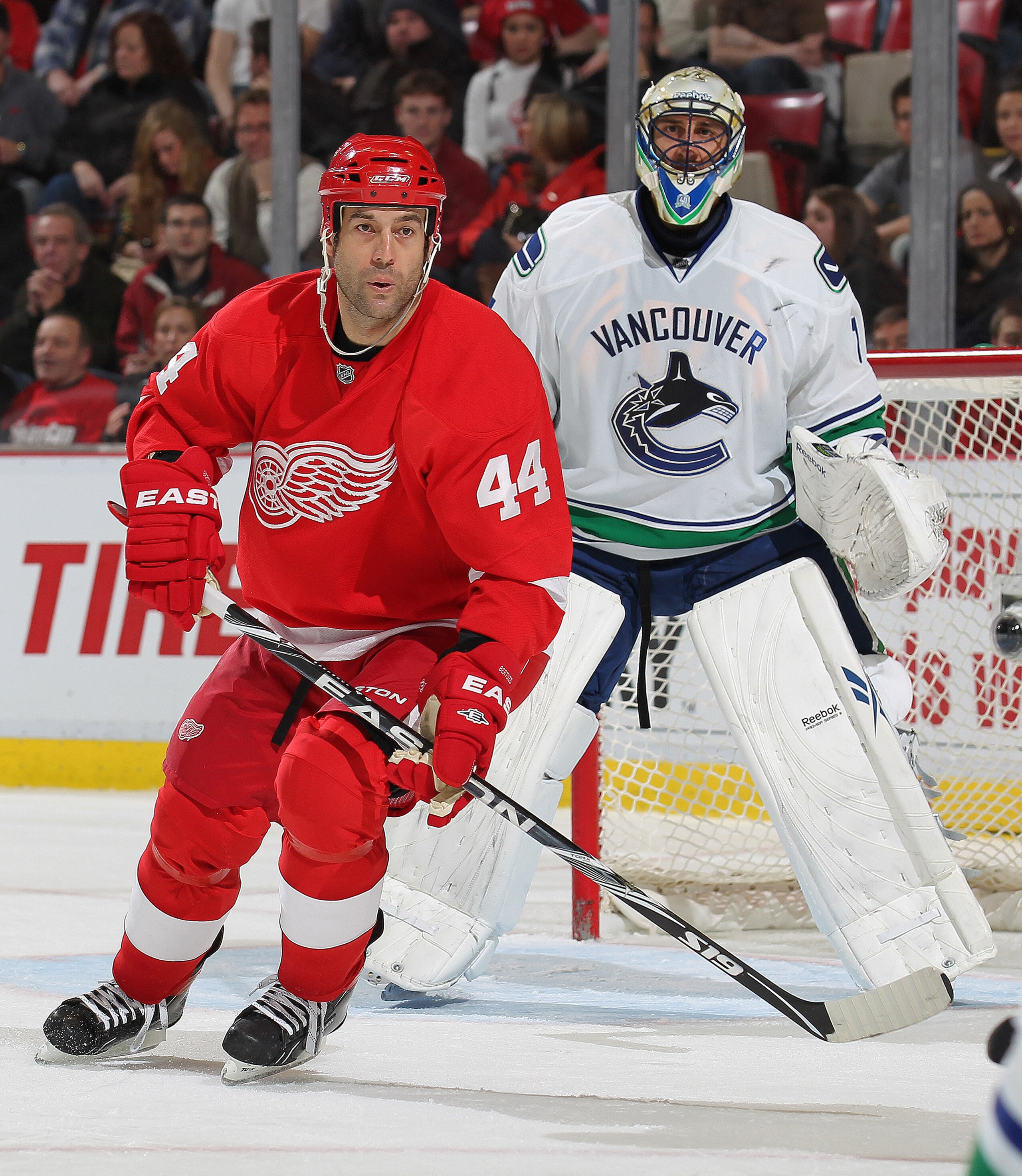 DETROIT, MI - DECEMBER 22:  Todd Bertuzzi #44 of the Detroit Red Wings turns in front of Roberto Luongo #1 of the Vancouver Canucks in a game on December 22, 2010 at the Joe Louis Arena in Detroit, Michigan. The Wings defeated the Canucks 5-4 in overtime.