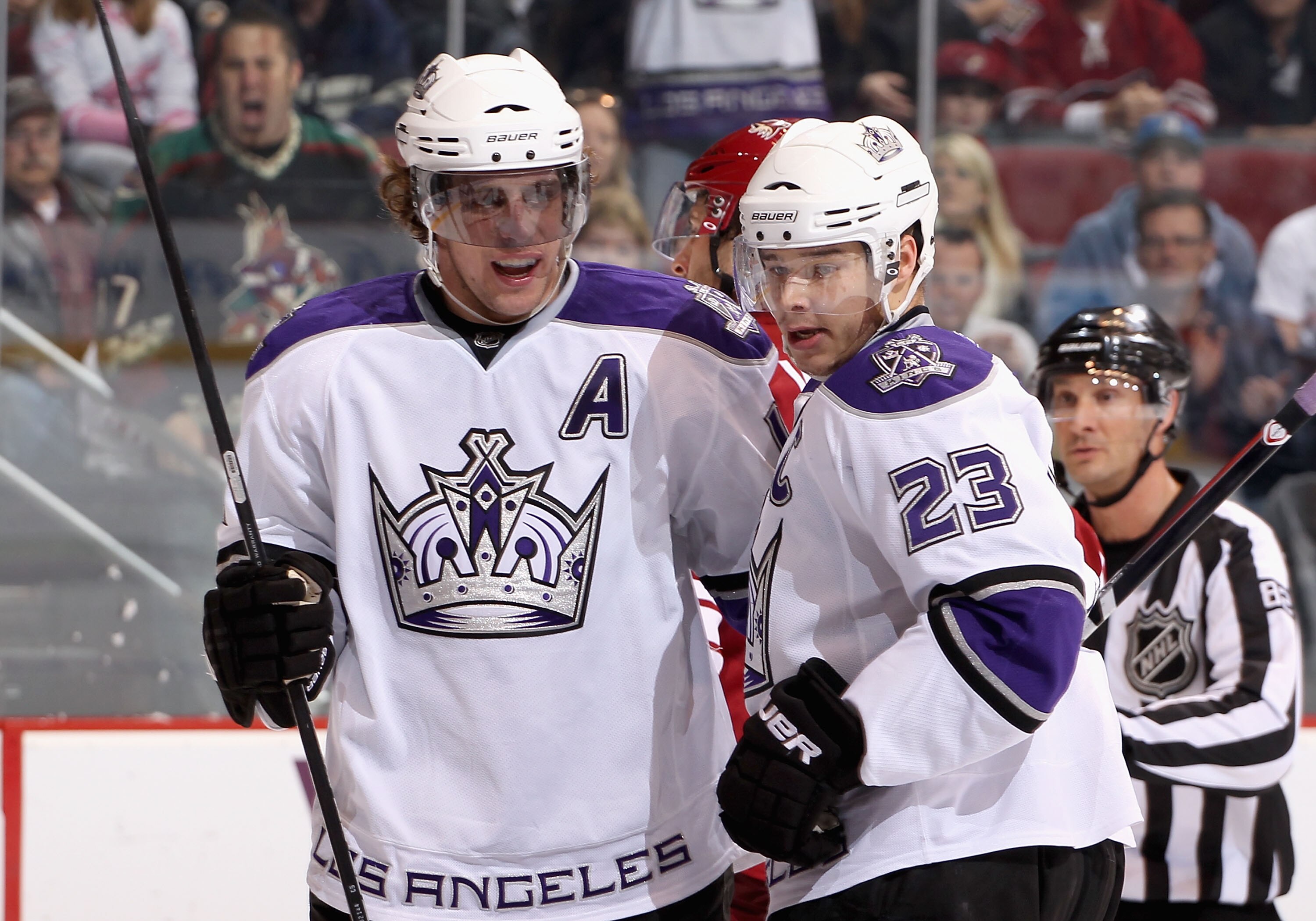 GLENDALE, AZ - DECEMBER 29:  Anze Kopitar #11 and Dustin Brown #23 of the Los Angeles Kings celebrate after Marco Sturm (not pictured) scored a first period goal against the Phoenix Coyotes during the NHL game at Jobing.com Arena on December 29, 2010 in G