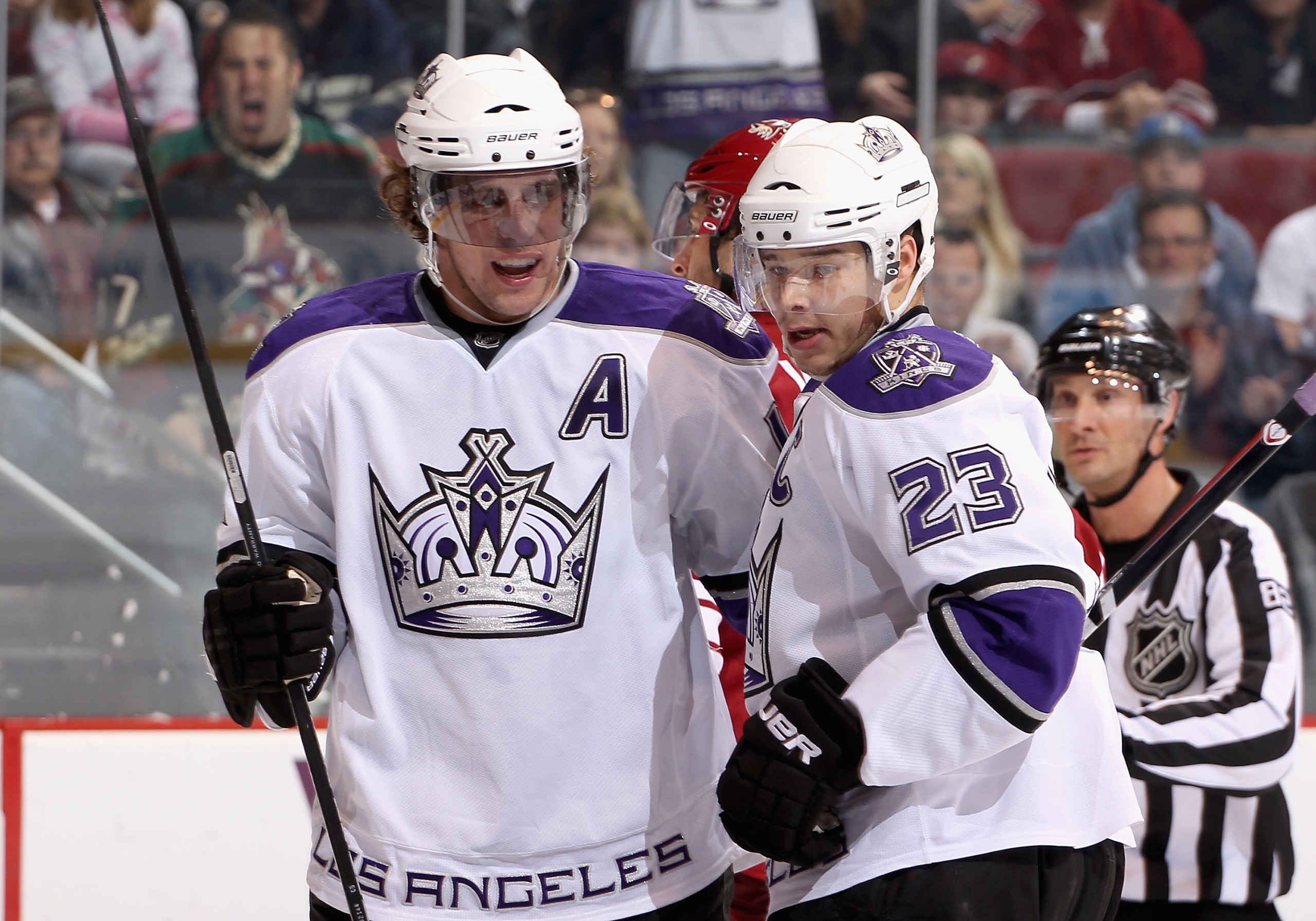GLENDALE, AZ - DECEMBER 29:  Anze Kopitar #11 and Dustin Brown #23 of the Los Angeles Kings celebrate after Marco Sturm (not pictured) scored a first period goal against the Phoenix Coyotes during the NHL game at Jobing.com Arena on December 29, 2010 in G