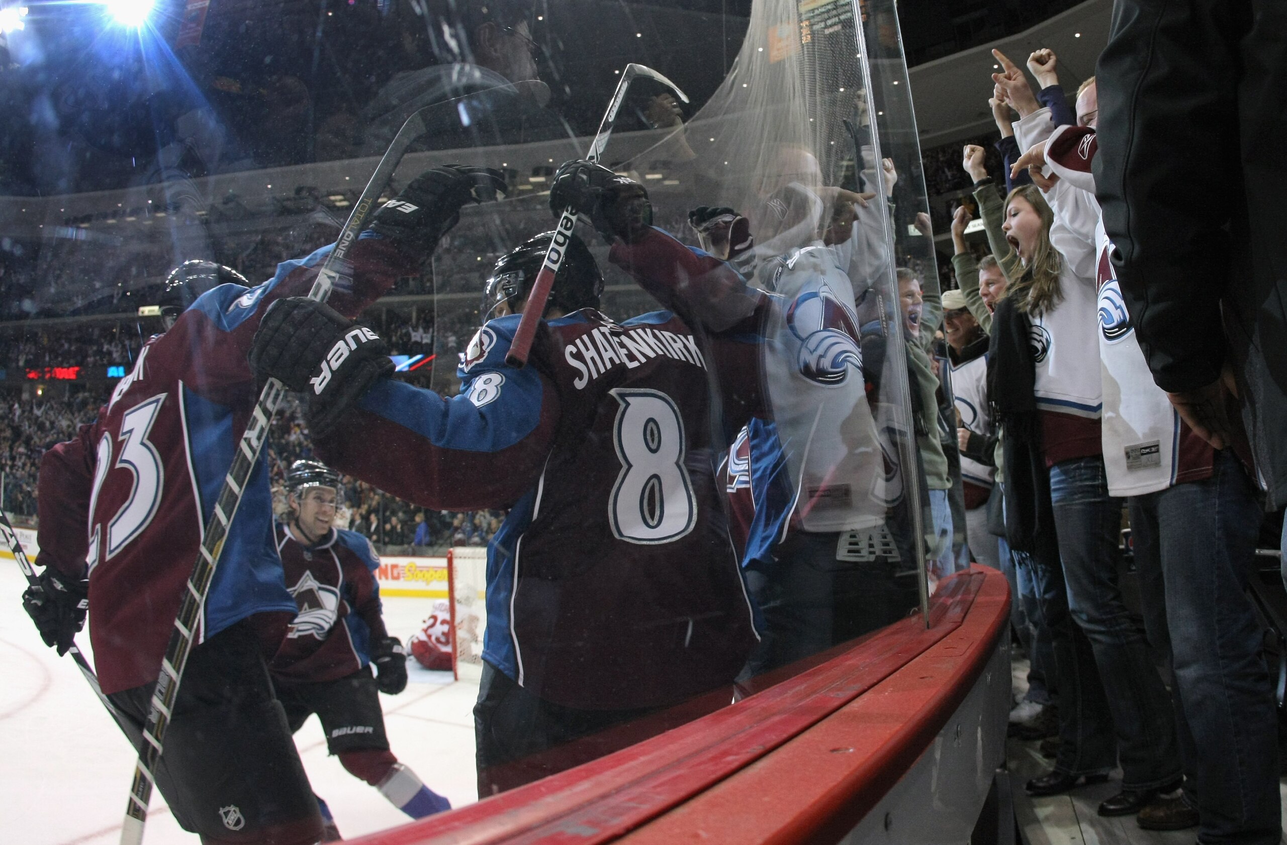 DENVER - DECEMBER 27:  Matt Duchene #9 of the Colorado Avalanche celebrates his third period goal with Milan Hejduk #23, John-Michael Liles #4 and Kevin Shattenkirk #8 in front of the fans against the Detroit Red Wings at the Pepsi Center on December 27,