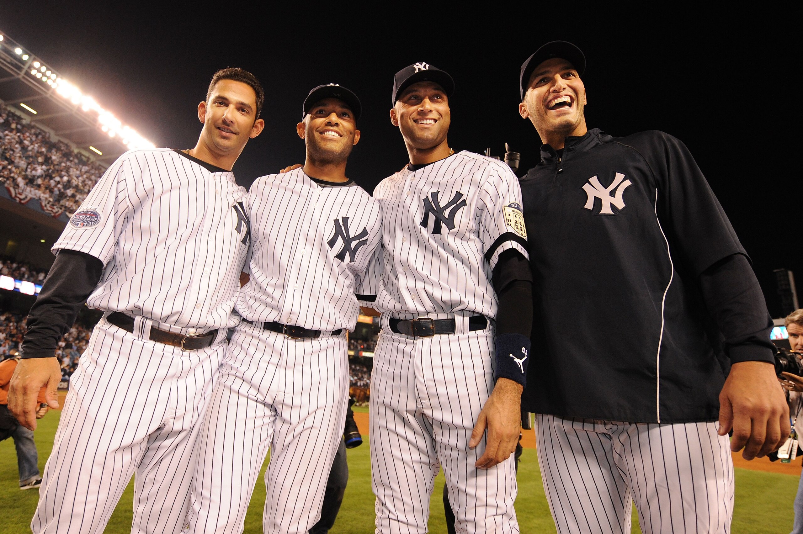 NEW YORK - SEPTEMBER 21:  Jorge Posada, Mariano Rivera, Derek Jeter, and Andy Pettitte of the New York Yankees pose on the pitchers mound after winning the last regular season game at Yankee Stadium 7-3 against the Baltimore Orioles on September 21, 2008