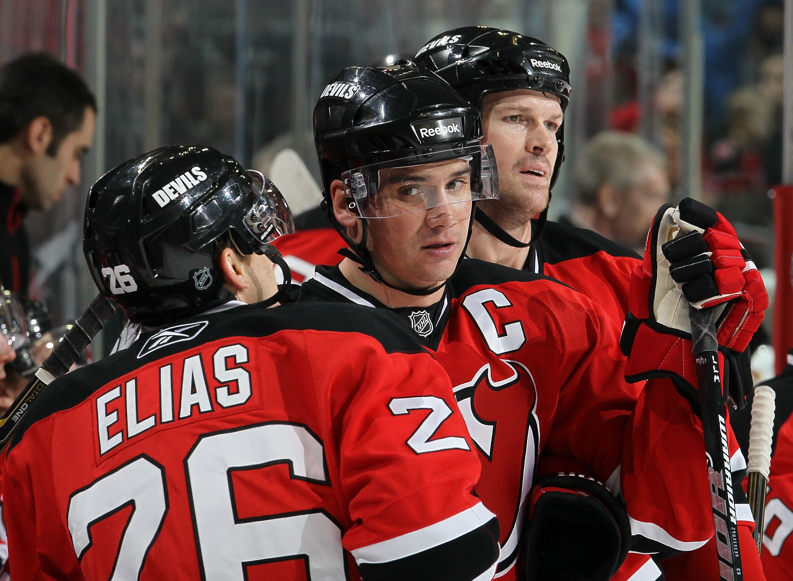NEWARK, NJ - DECEMBER 31:  Jamie Langenbrunner #15 of the New Jersey Devils looks on during a timeout against of the Atlanta Thrashers with teammates Patrik Elias #26 and Jason Arnott #25 at the Prudential Center on December 31, 2010 in Newark, New Jersey