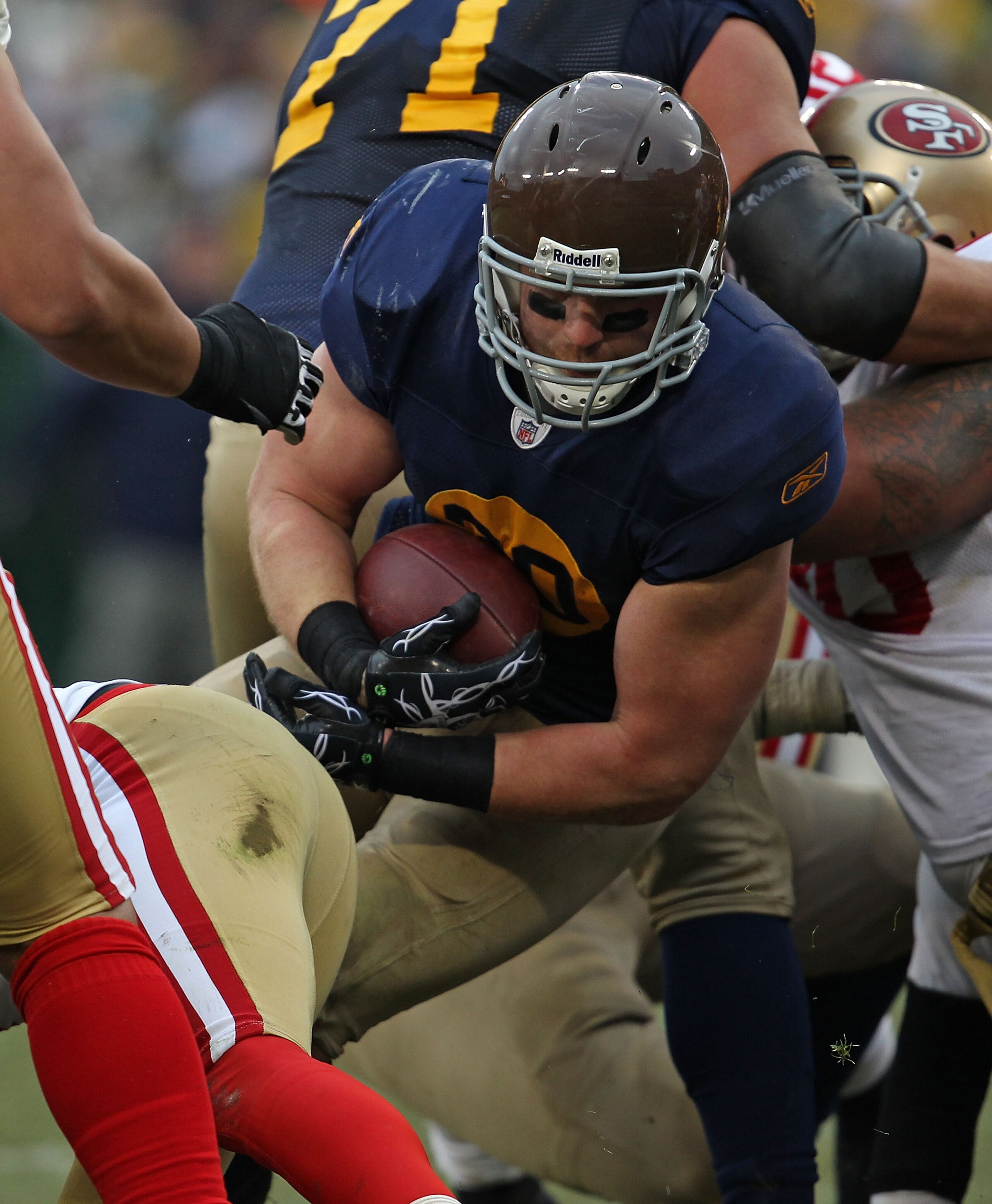 GREEN BAY, WI - DECEMBER 05: John Kuhn #30 of the Green Bay Packers runs against the San Francisco 49ers at Lambeau Field on December 5, 2010 in Green Bay, Wisconsin. The Packers defeated the 49ers 34-16. (Photo by Jonathan Daniel/Getty Images)