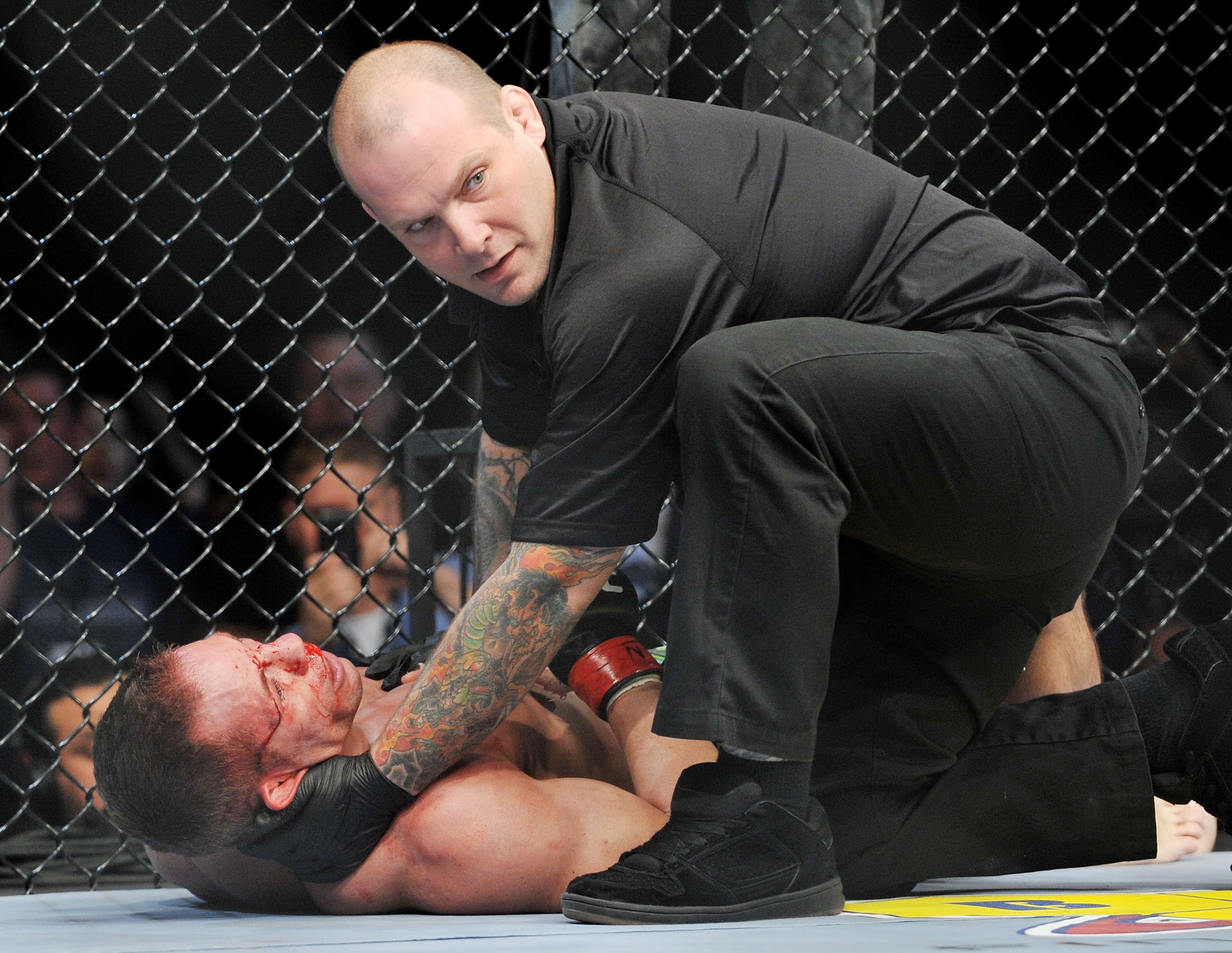LAS VEGAS - NOVEMBER 21: Marcus Davis (L) gets knocked out by Ben Saunders during their Welterweight Fight at the UFC 106 at Mandalay Bay Events Center on November 21, 2009 in Las Vegas, Nevada. (Photo by Jon Kopaloff/Getty Images)