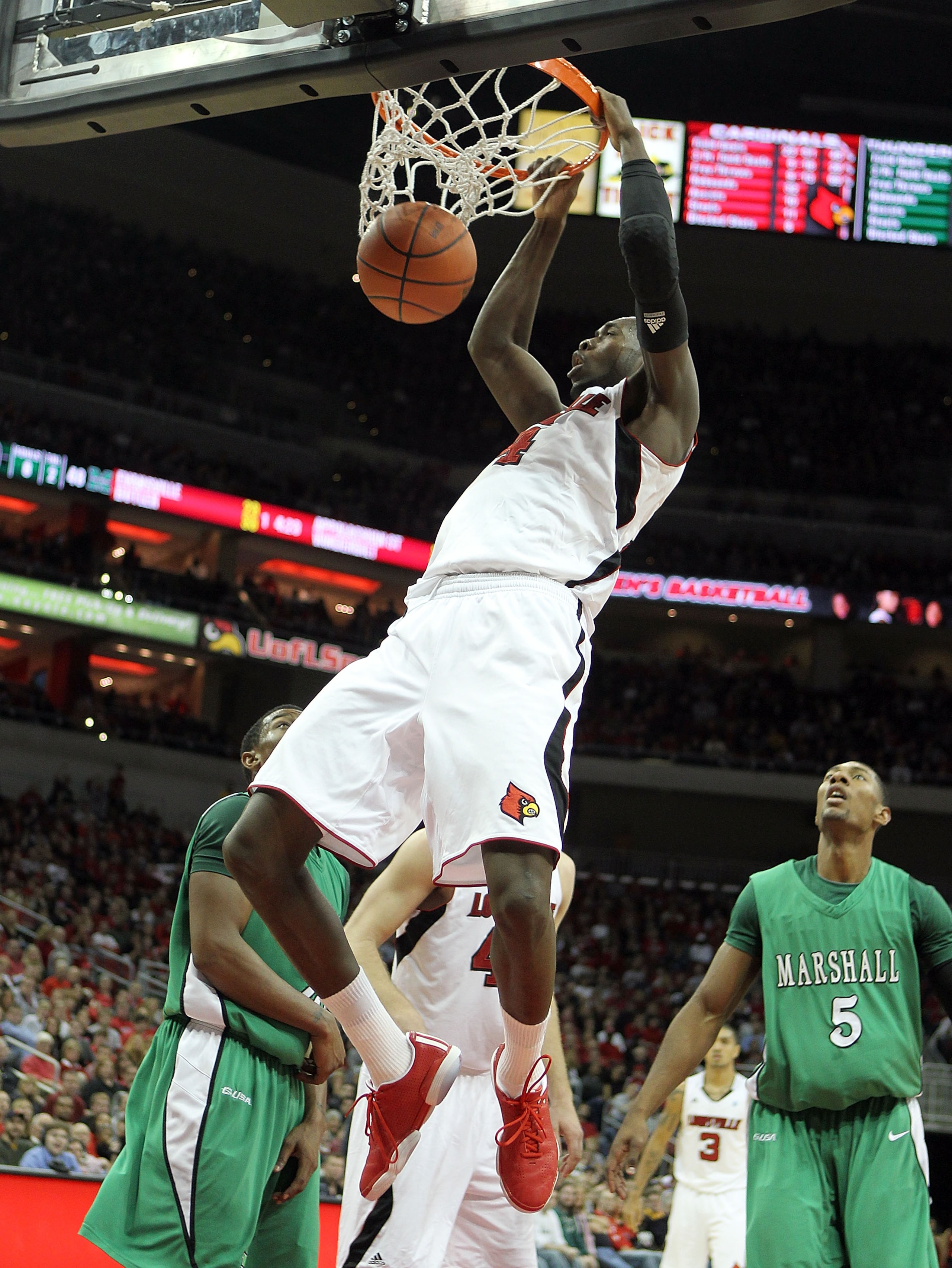 LOUISVILLE, KY - NOVEMBER 27: Rakeem Buckles #4 of the Louisville Cardinals dunks the ball during the game against the Marshall Thundering Herd at the KFC Yum! Center on November 27, 2010 in Louisville, Kentucky. Louisville won 80-66. (Photo by Andy Lyo LOUISVILLE, KY - NOVEMBER 27: Rakeem Buckles #4 of the Louisville Cardinals dunks the ball during the game against the Marshall Thundering Herd at the KFC Yum! Center on November 27, 2010 in Louisville, Kentucky. Louisville won 80-66. (Photo by Andy Lyo