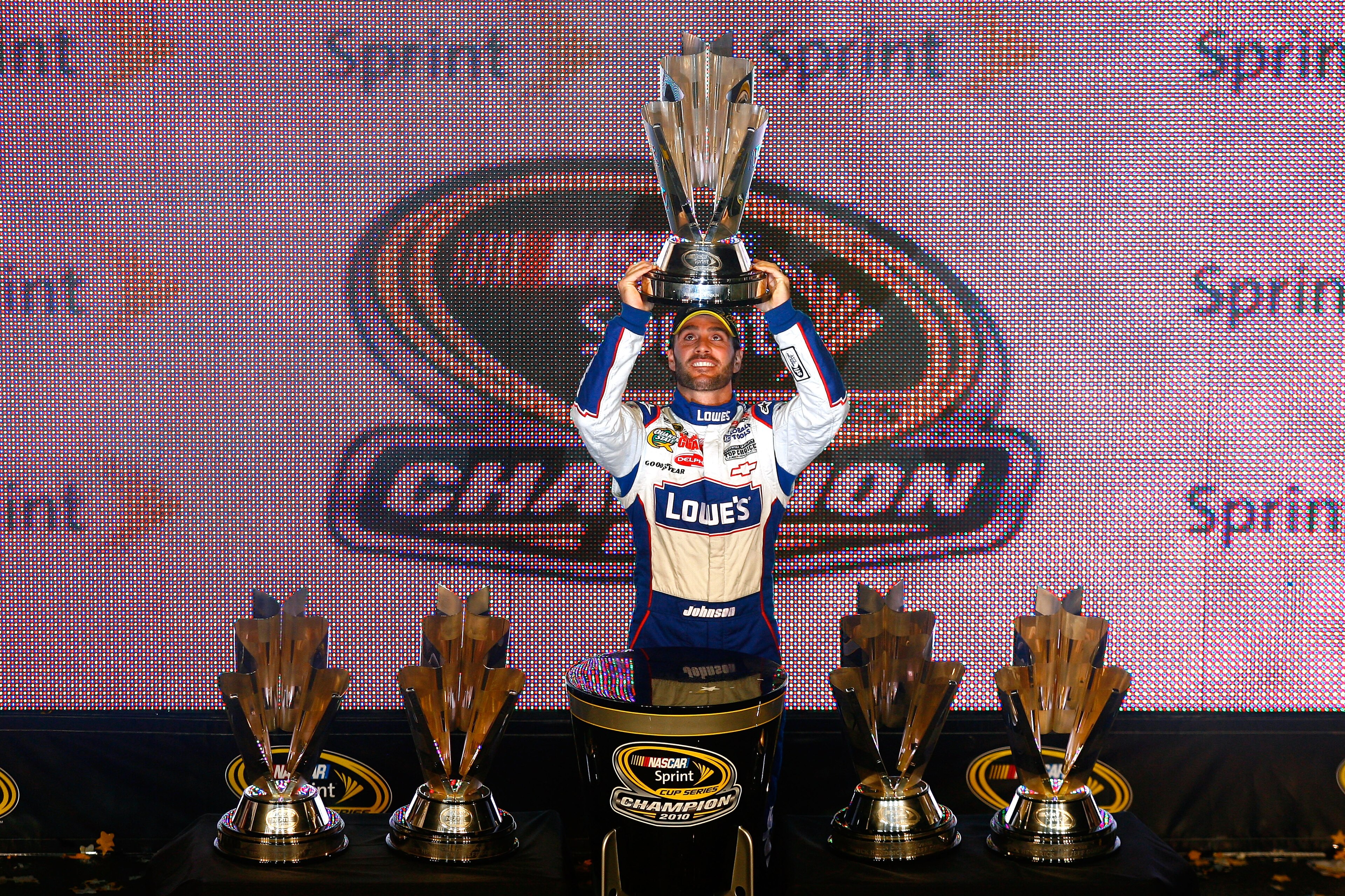 HOMESTEAD, FL - NOVEMBER 21:  Jimmie Johnson, driver of the #48 Lowe's Chevrolet, celebrates after finishing in second place in the Ford 400 to clinch his fifth consecutive NASCAR Sprint Cup championship at Homestead-Miami Speedway on November 21, 2010 in