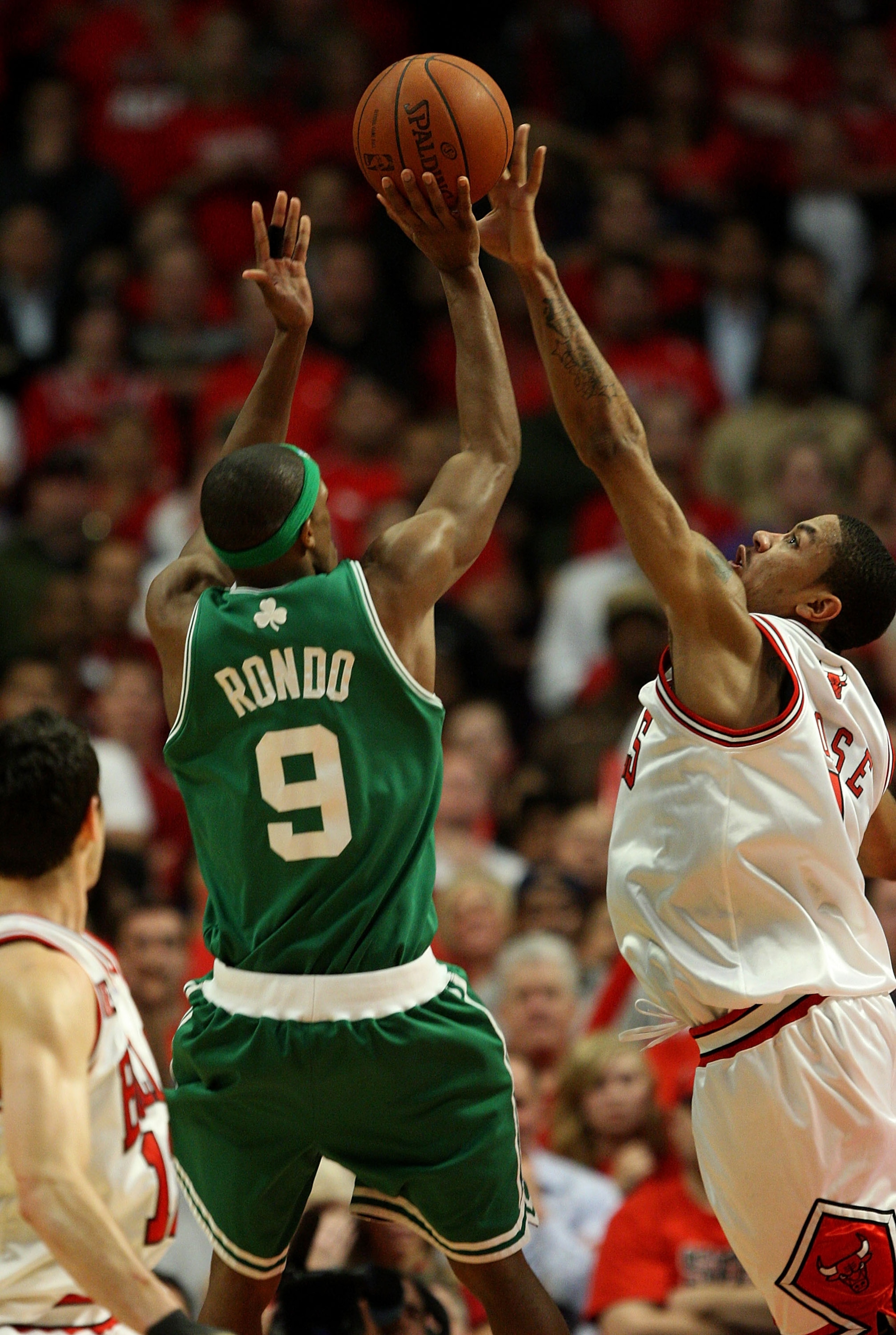 CHICAGO - APRIL 30: Derrick Rose #1 of the Chicago Bulls blocks a shot in the closing seconds of the third overtime period by Rajon Rondo #9 of the Boston Celtics in Game Six of the Eastern Conference Quarterfinals during the 2009 NBA Playoffs at the Unit