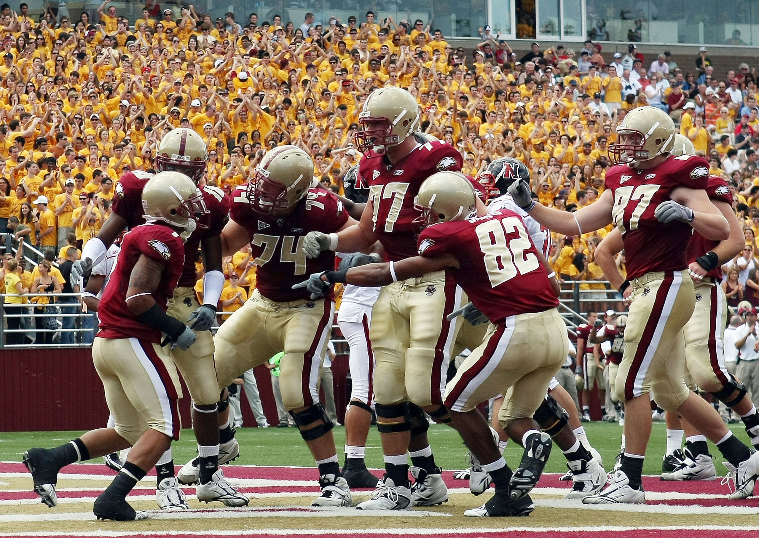 CHESTNUT HILL, MA - SEPTEMBER 05:  Josh Haden #1 of the Boston College Eagles is congratulated by teammates Rich Gunnell #18,Anthony Castonzo #74,Emmett Cleary #77,Justin Jarvis #82 and Lars Anderson #87 after Haden scored a touchdown in the first half ag