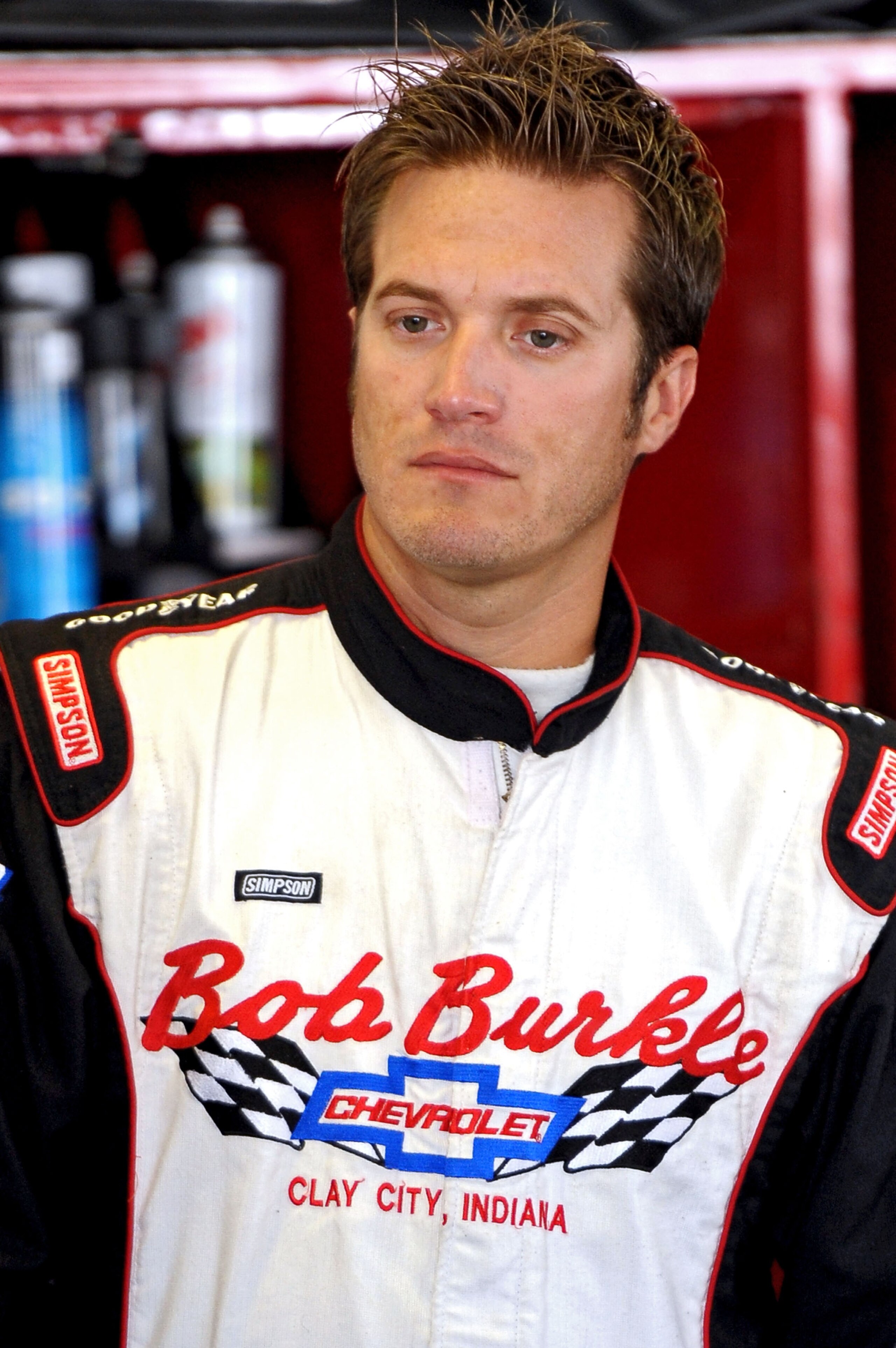 LONG POND, PA - JULY 31:  J.J. Yeley, driver of the #46 Cash America Dodge, stands in the garage during practice for the NASCAR Sprint Cup Series Sunoco Red Cross Pennsylvania 500 at Pocono Raceway on July 31, 2010 in Long Pond, Pennsylvania.  (Photo by D