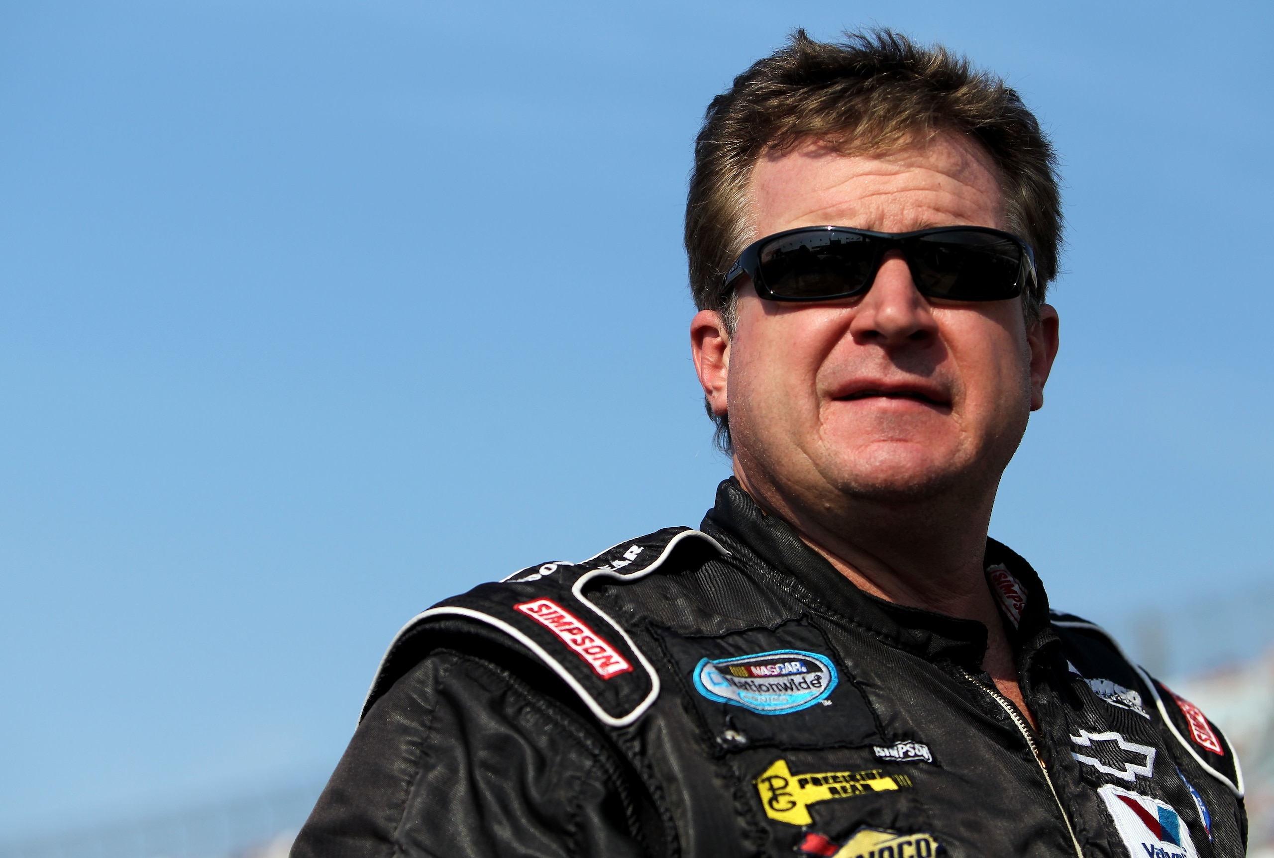 DOVER, DE - SEPTEMBER 24:  Joe Nemechek, driver of the #87 Nemco Motorsports Toyota, stands on the grid during qualifying for the NASCAR Sprint Cup Series AAA 400 at Dover International Speedway on September 24, 2010 in Dover, Delaware.  (Photo by Nick La