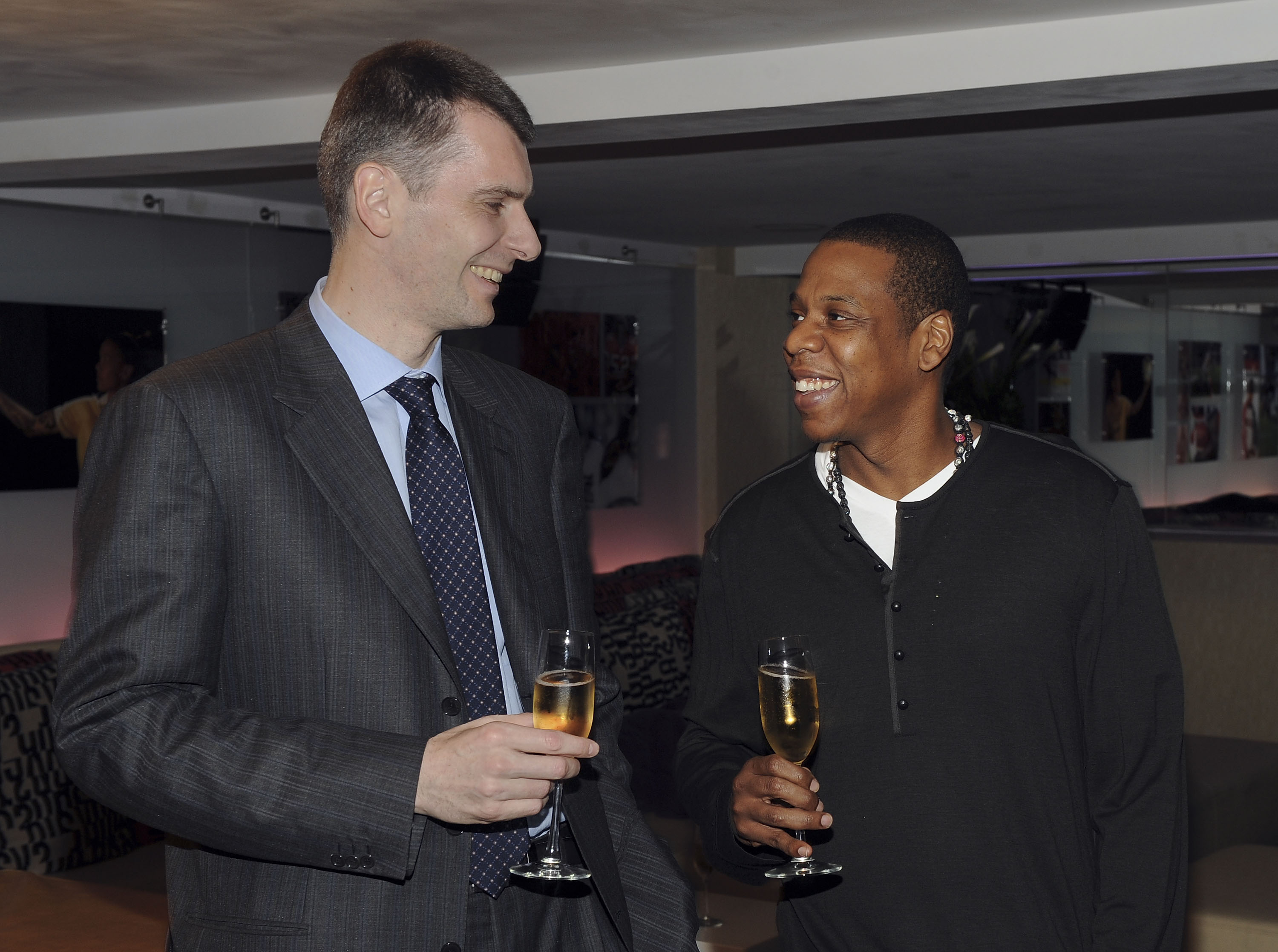 NEW YORK - MAY 18:  (EXCLUSIVE) Nets owner Mikhail Prokhorov with cultural icon and Nets investor JAY-Z celebrate Prokhorov's purchase of the team at lunch today at JAY-Z's 40/40 club on May 18, 2010 in New York City. Prokhorov is representing the Nets to