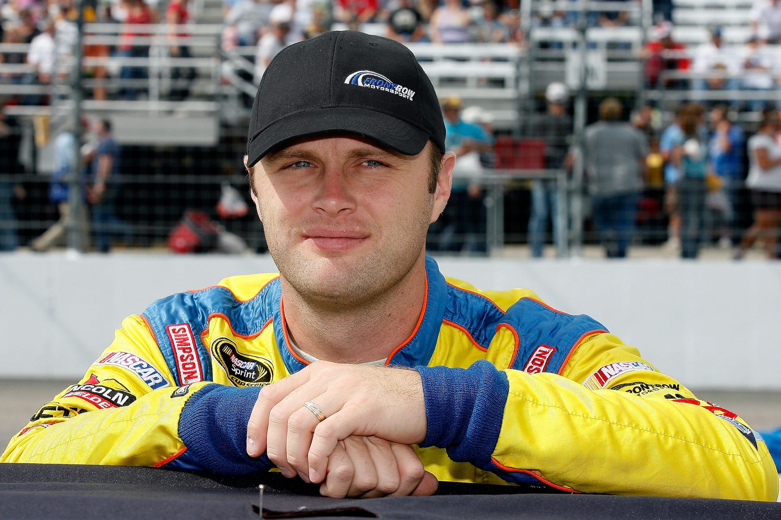 LOUDON, NH - SEPTEMBER 19:  Travis Kvapil, driver of the #38 Long John Silver's Ford, stands on the grid during the NASCAR Sprint Cup Series Sylvania 300 at New Hampshire Motor Speedway on September 19, 2010 in Loudon, New Hampshire.  (Photo by Tom Whitmo