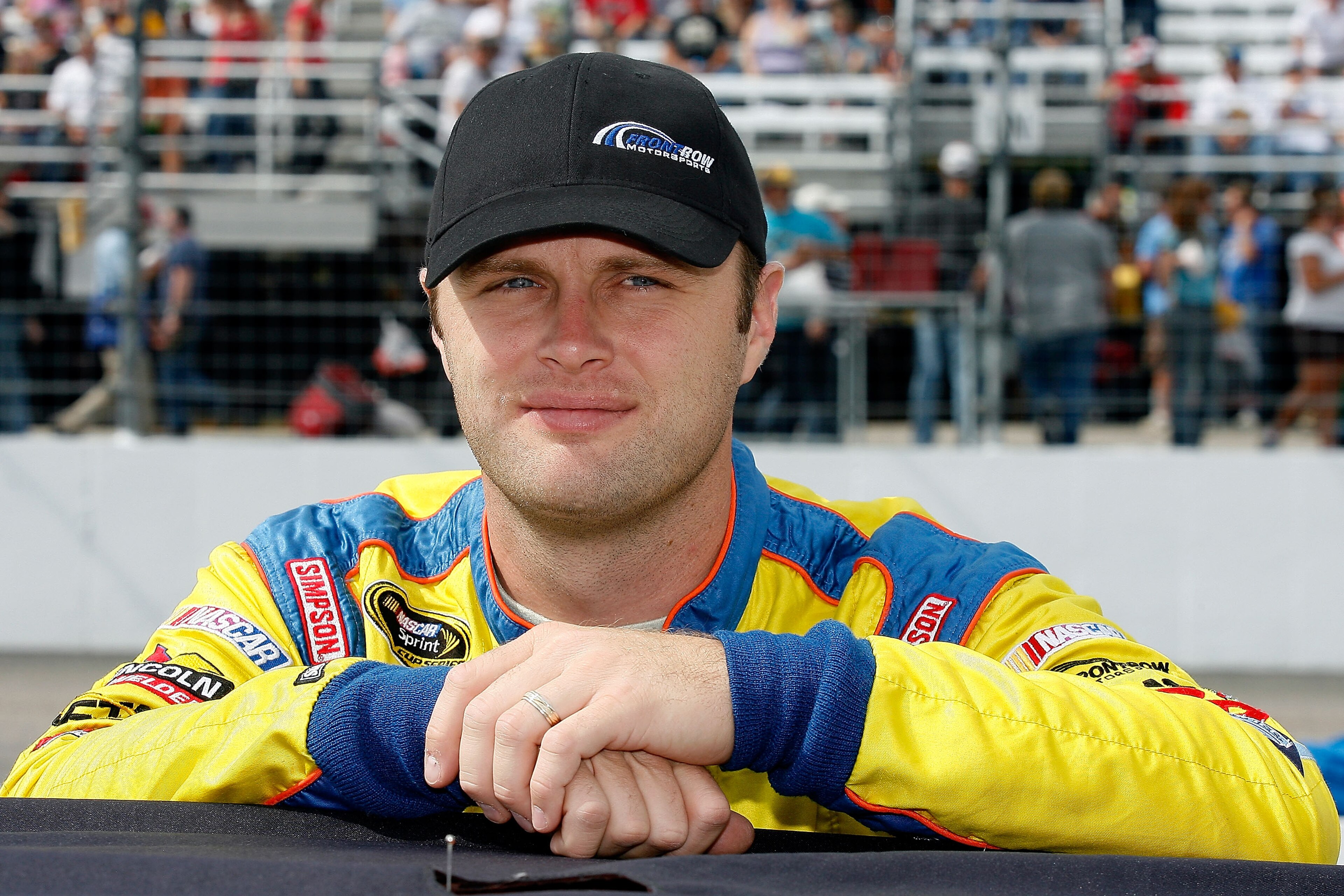 LOUDON, NH - SEPTEMBER 19:  Travis Kvapil, driver of the #38 Long John Silver's Ford, stands on the grid during the NASCAR Sprint Cup Series Sylvania 300 at New Hampshire Motor Speedway on September 19, 2010 in Loudon, New Hampshire.  (Photo by Tom Whitmo