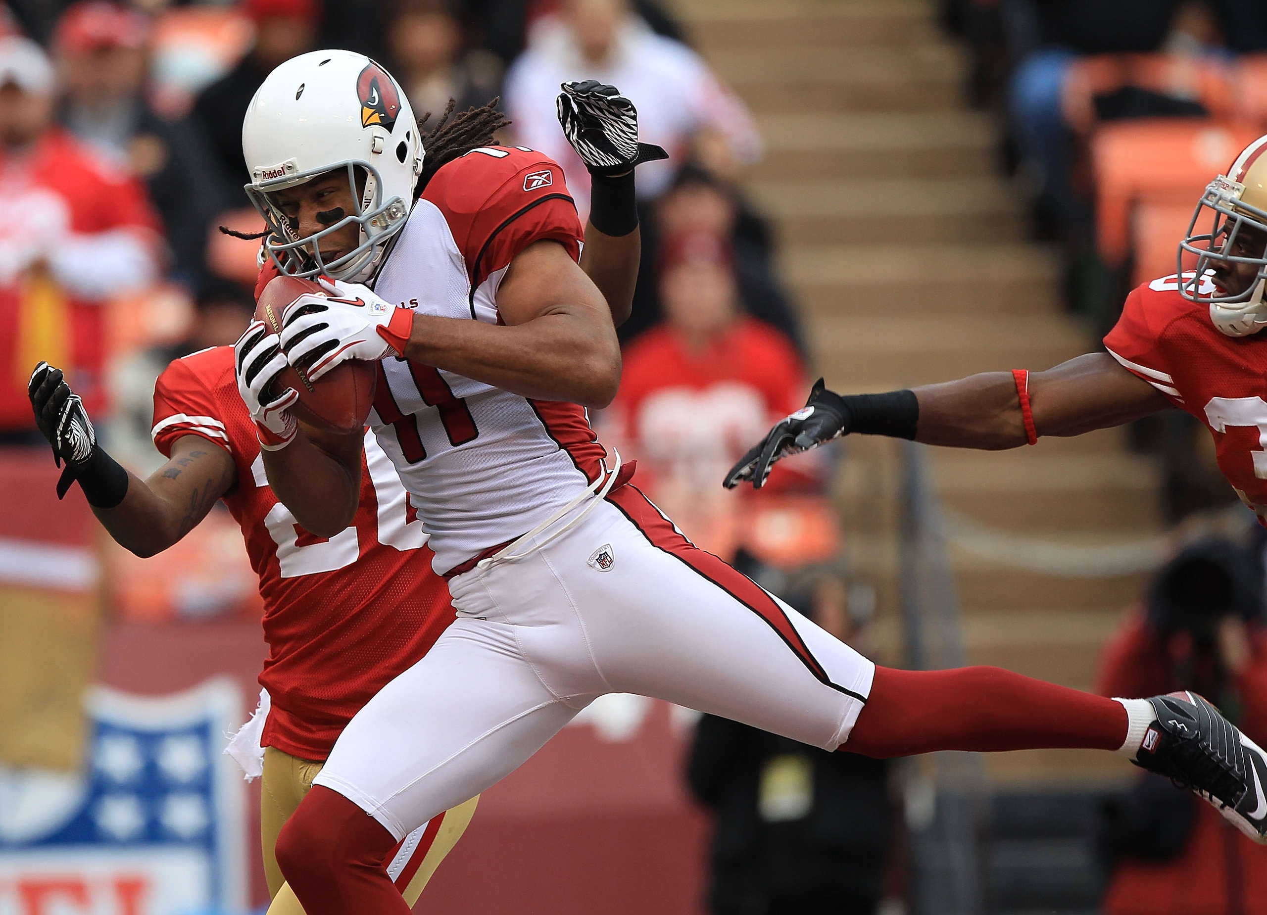 SAN FRANCISCO, CA - JANUARY 2: Larry Fitzgerald #11 of the Arizona Cardinals catches a touchdown against the San Francisco 49er during an NFL game at Candlestick Park on January 2, 2011 in San Francisco, California.(Photo by Jed Jacobsohn/Getty Images) SAN FRANCISCO, CA - JANUARY 2: Larry Fitzgerald #11 of the Arizona Cardinals catches a touchdown against the San Francisco 49er during an NFL game at Candlestick Park on January 2, 2011 in San Francisco, California.(Photo by Jed Jacobsohn/Getty Images)