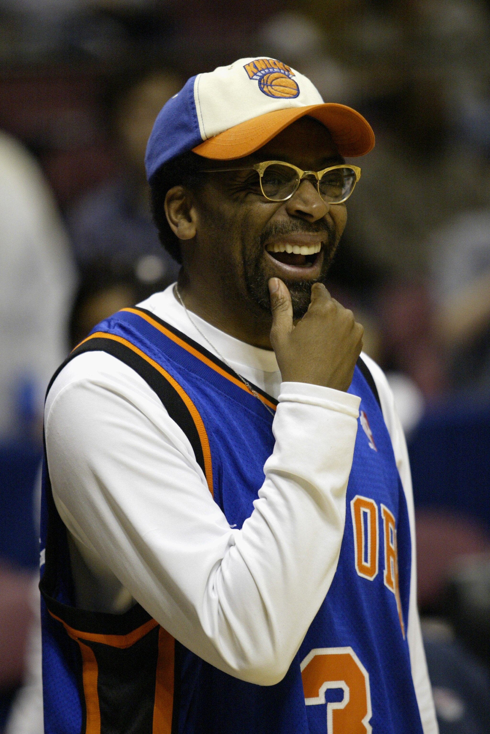EAST RUTHERFORD, NJ - APRIL 17:  Director/Die-hard New York Knicks fan Spike Lee smiles during Game One of the Eastern Conference Quarterfinals of the 2004 NBA Playoffs against the New Jersey Nets on April 17, 2004 at the Continental Airlines Arena in Eas
