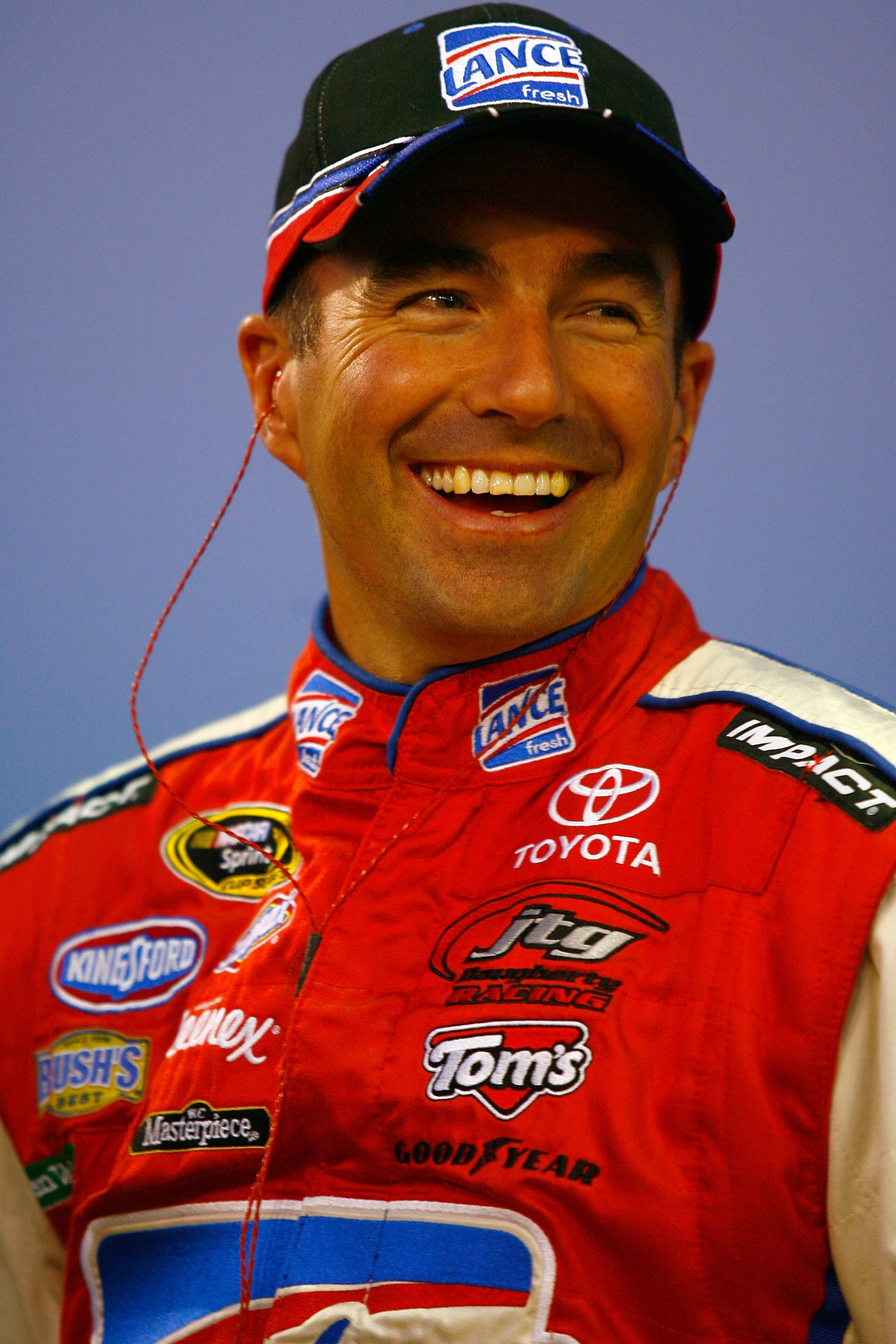 CONCORD, NC - OCTOBER 14:  Marcos Ambrose, driver of the #47 Little Debbie Toyota, stands on the grid during qualifying for the NASCAR Sprint Cup Series Bank of America 500 at Charlotte Motor Speedway on October 14, 2010 in Concord, North Carolina.  (Phot