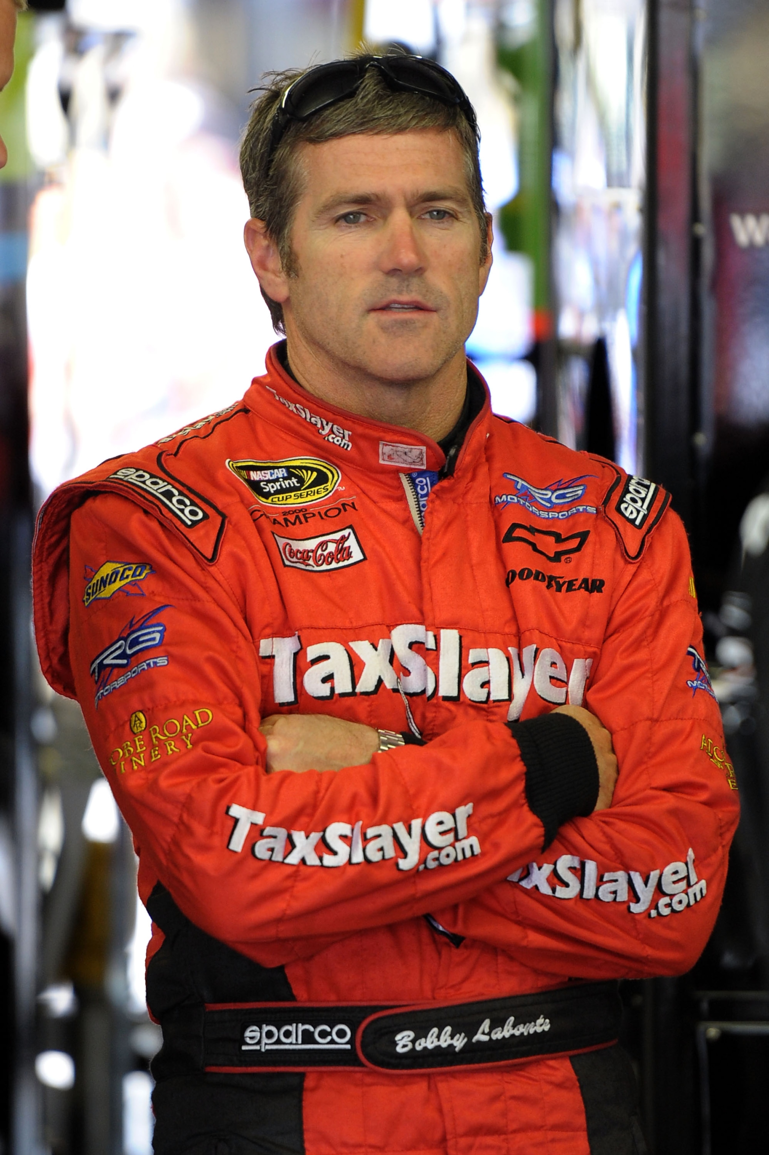LOUDON, NH - JUNE 26:  Bobby Labonte, driver of the #7 SpeedFactory.TV Toyota, stands in the garage during practice for the NASCAR Sprint Cup Series LENOX Industrial Tools 301 at New Hampshire Motor Speedway on June 26, 2010 in Loudon, New Hampshire.  (Ph